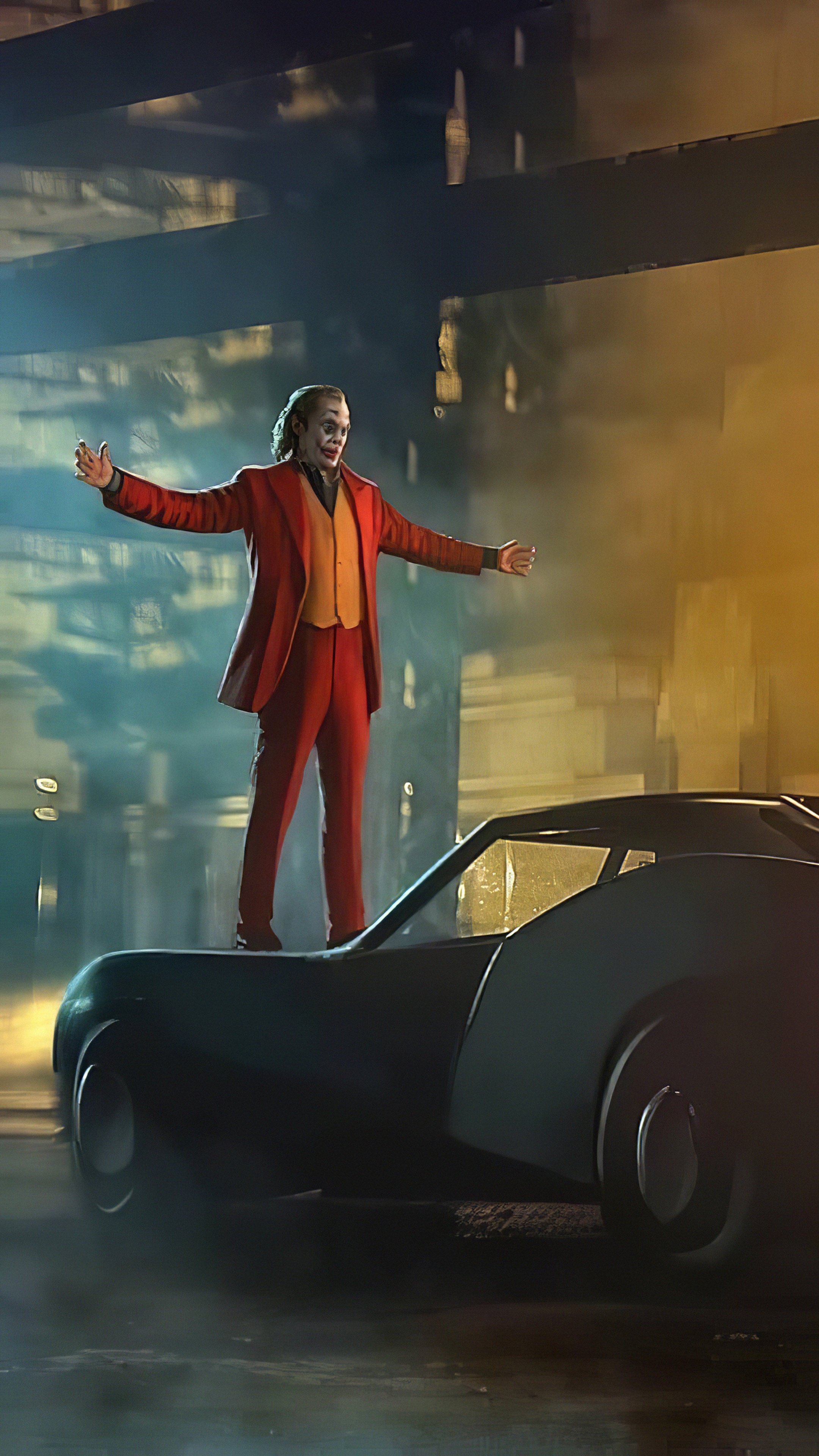 Joker standing on a car in a city HD Phone Wallpaper