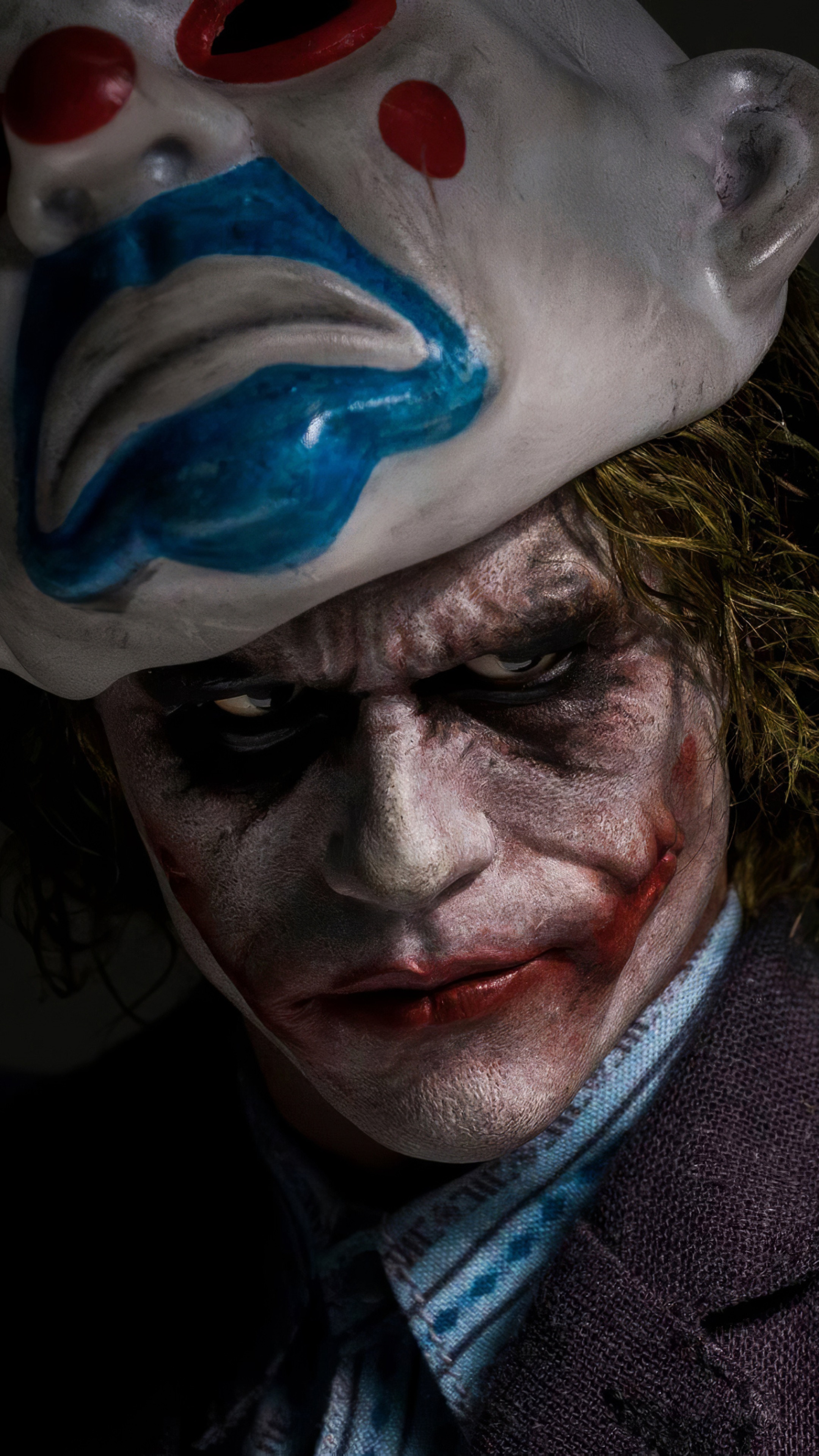 Joker from DC Comics wearing a clown mask HD Phone Wallpaper