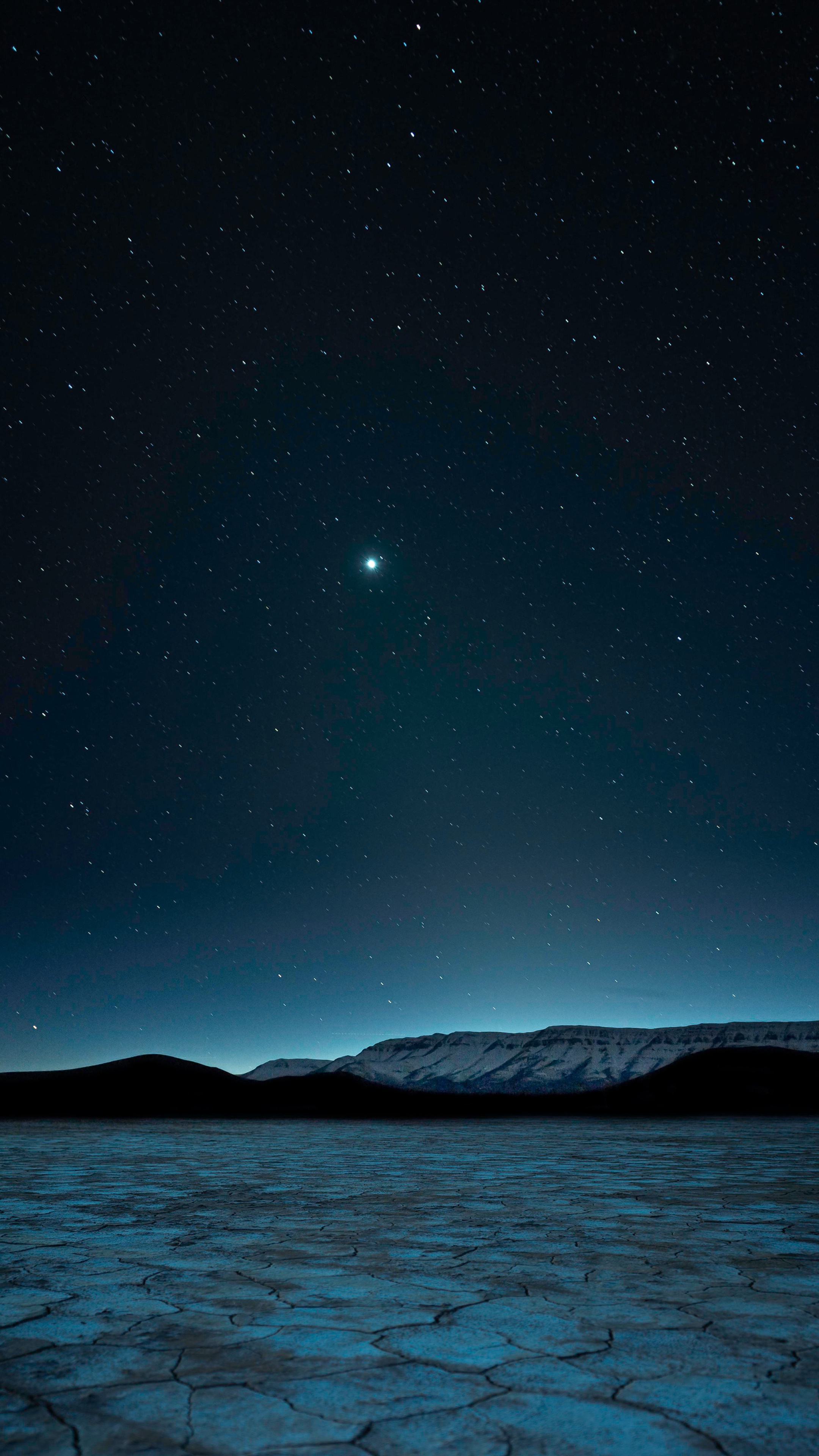 Desert landscape under starry night sky 4K HD Phone Wallpaper