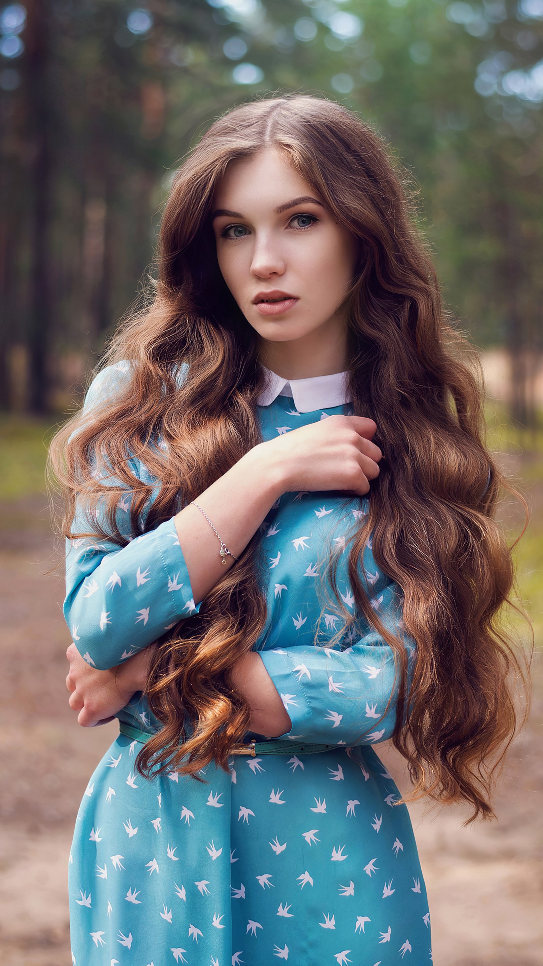 Girl in blue dress with bird pattern in forest HD Phone Wallpaper