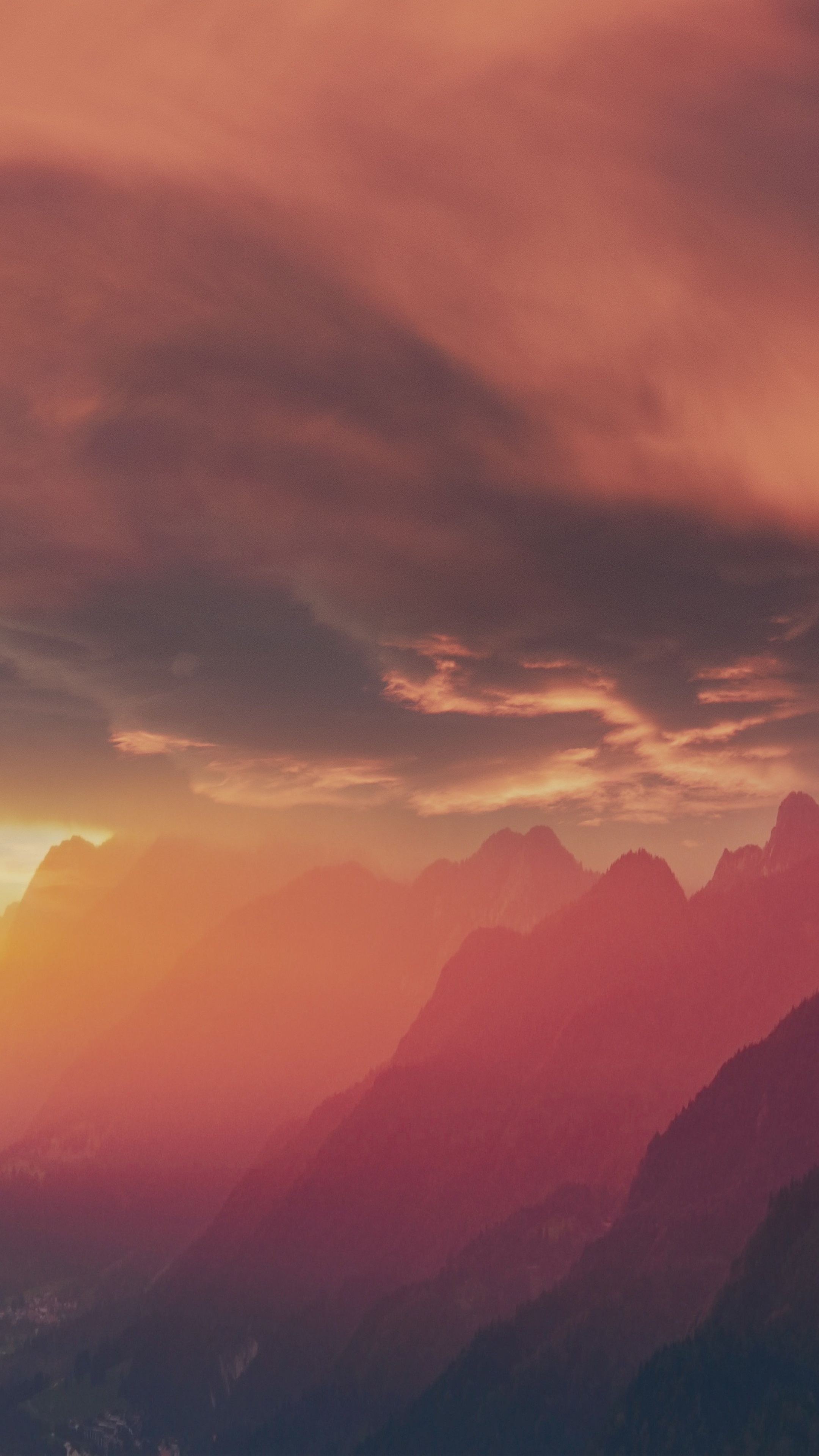 Mountains shrouded in fog during sunrise or sunset HD Phone Wallpaper