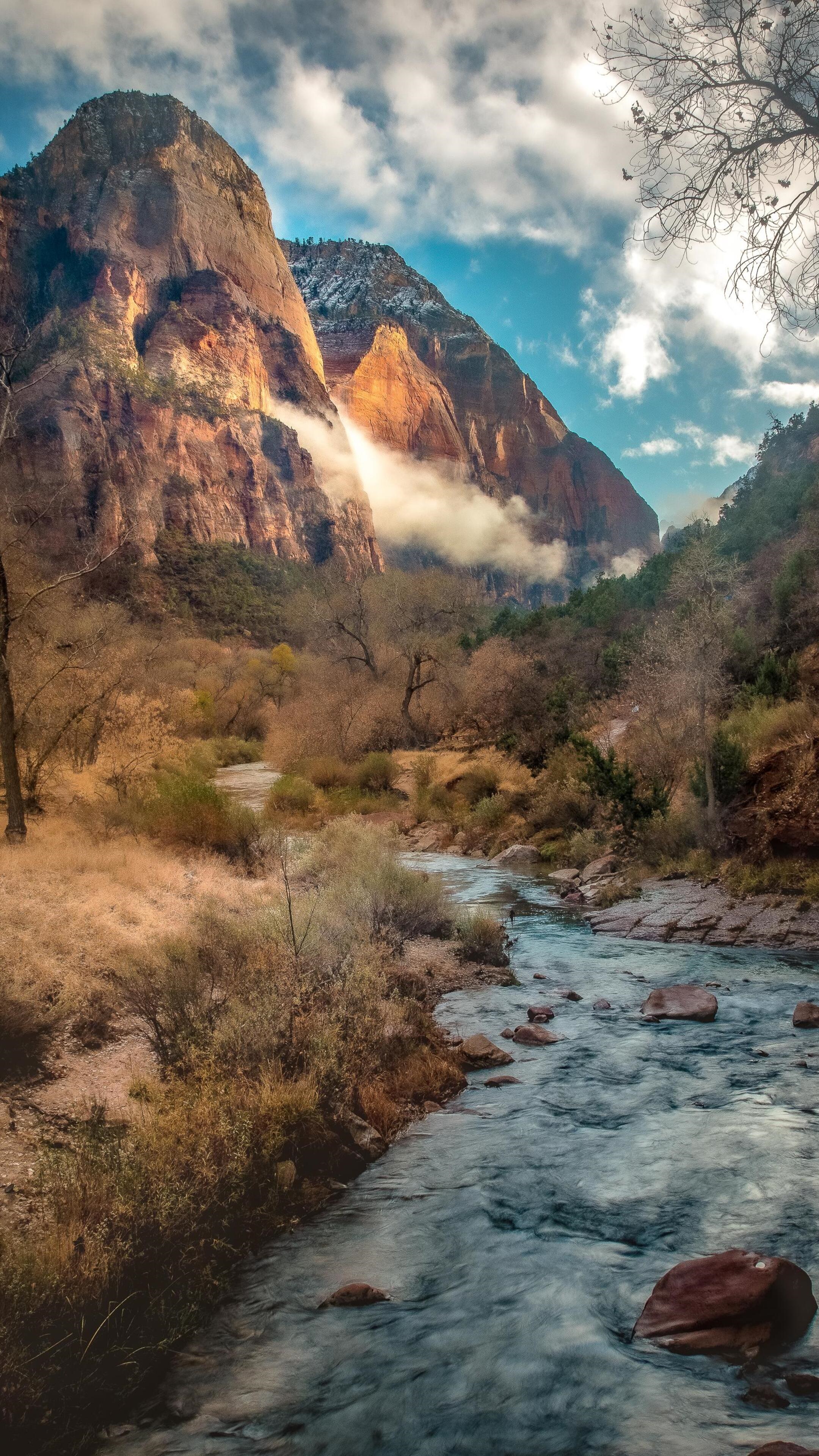 River flowing through a canyon with mountains HD Phone Wallpaper