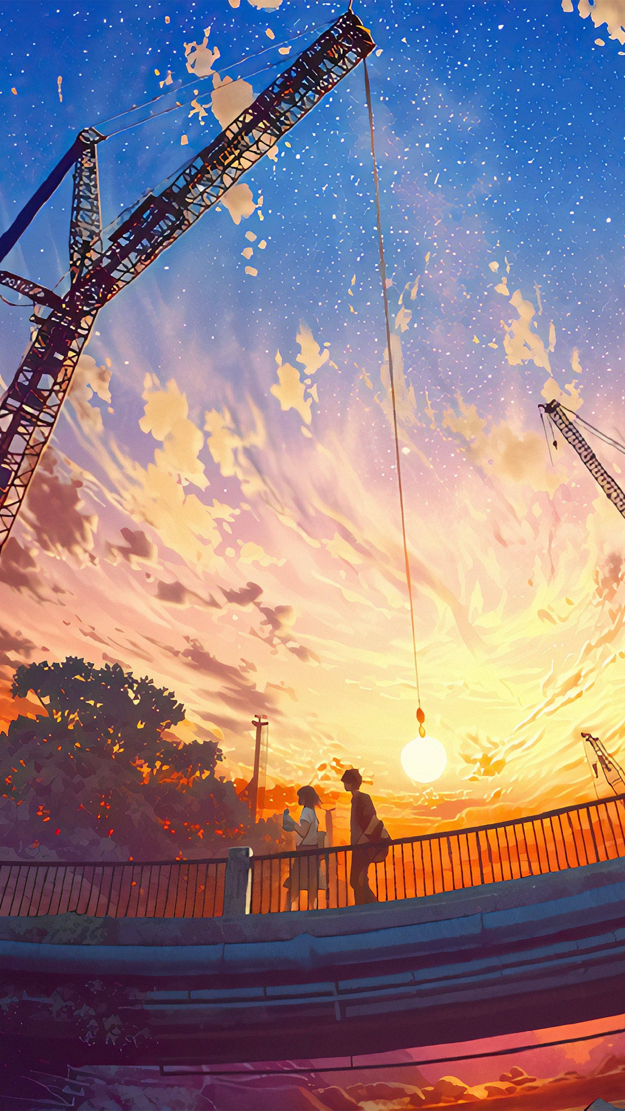 Couple on bridge with cranes at sunset HD Phone Wallpaper