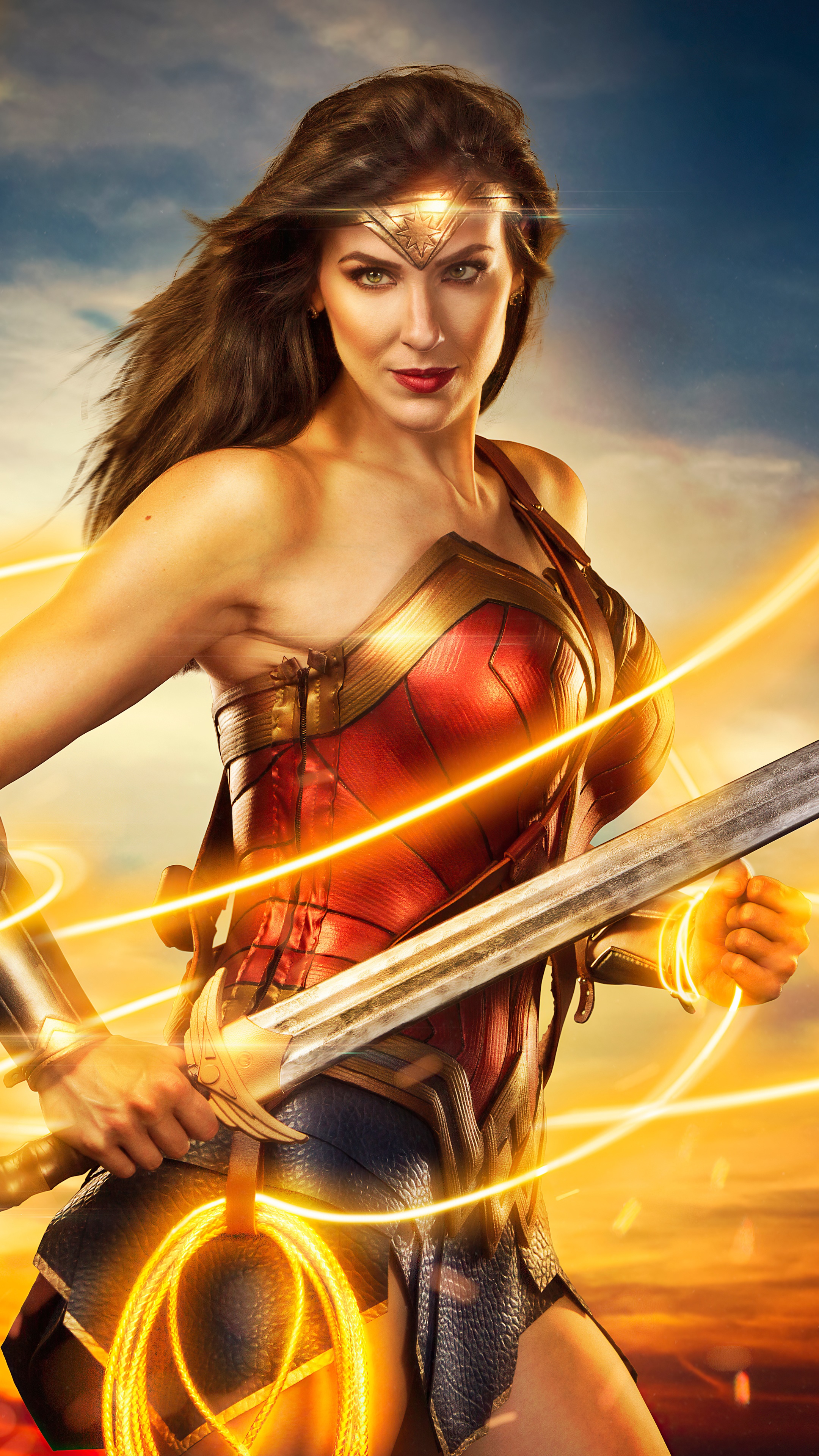 Wonder Woman holding a sword and lasso HD Phone Wallpaper