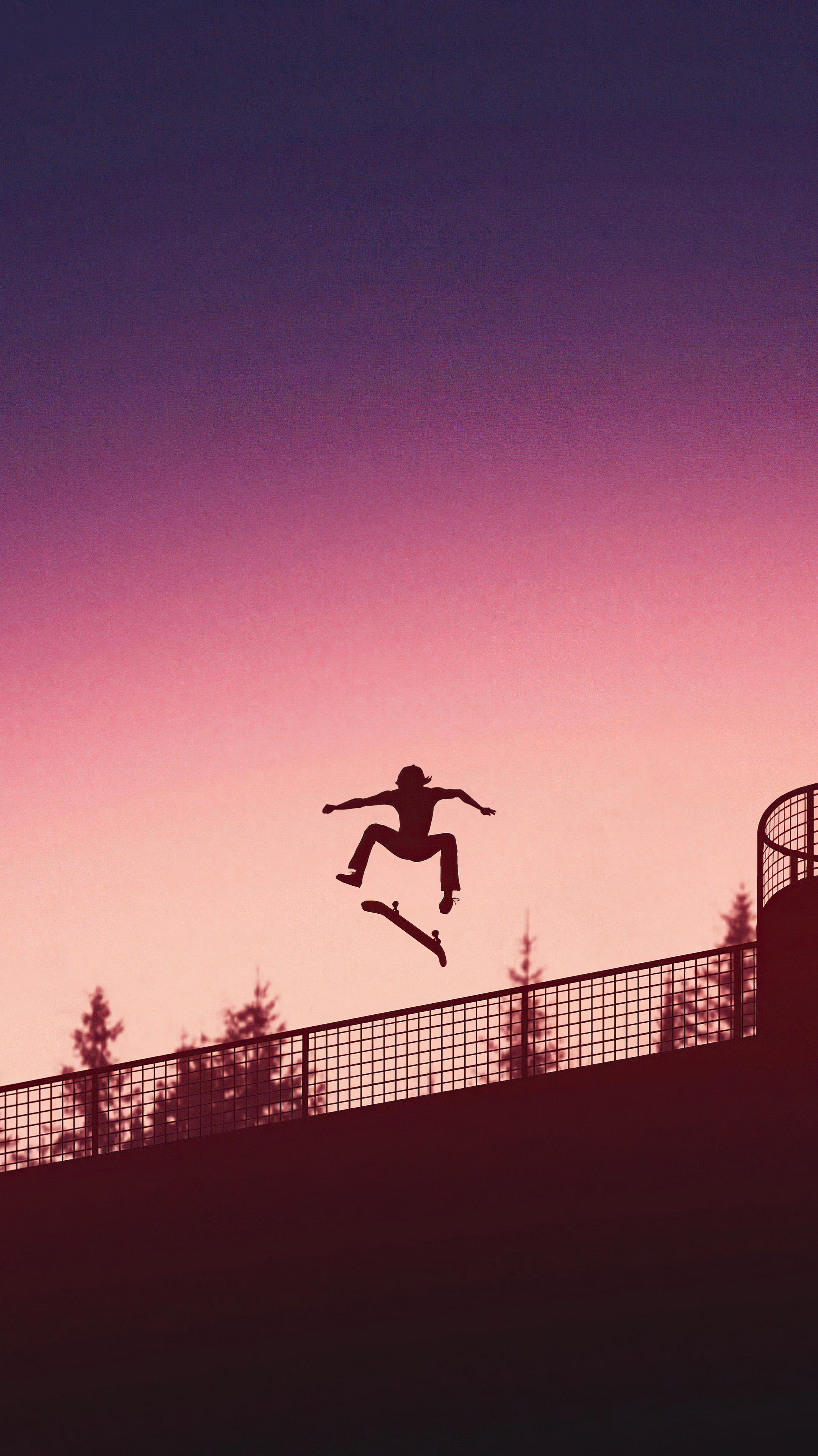 Skateboarder performing a trick at sunset HD Phone Wallpaper