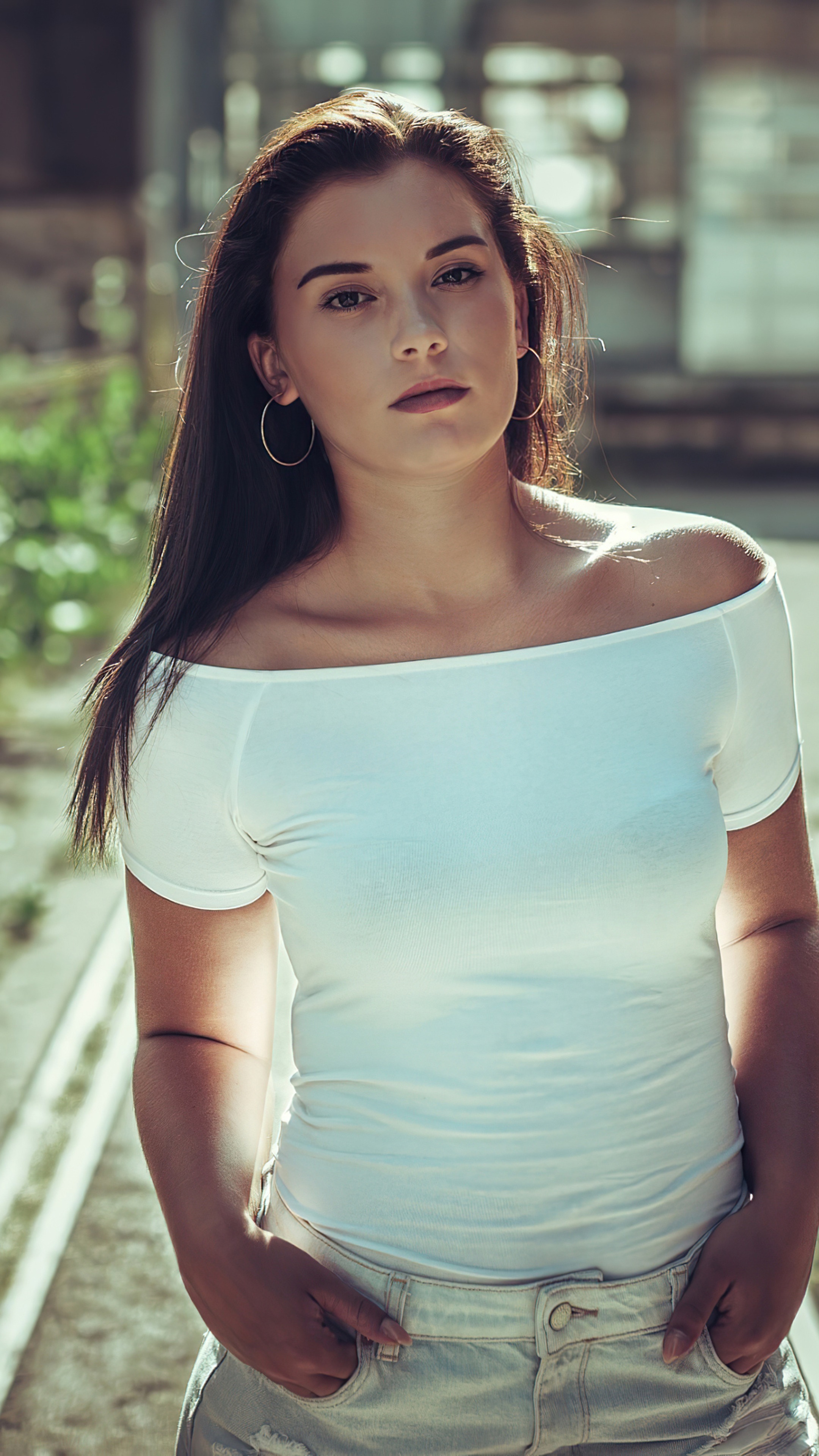 Model in white off-the-shoulder top and denim shorts HD Phone Wallpaper