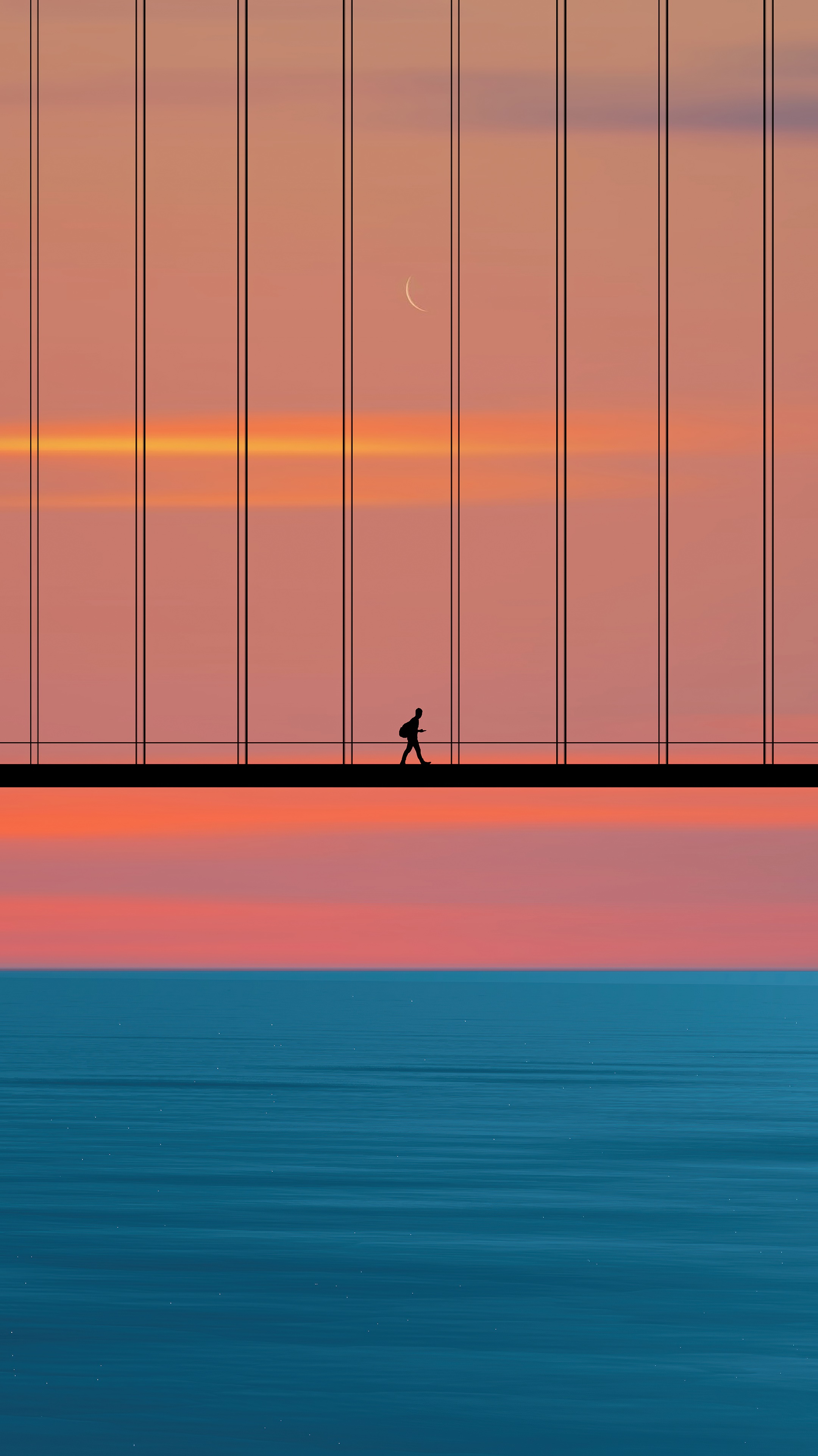 Silhouette of a person walking on a bridge at sunset HD Phone Wallpaper