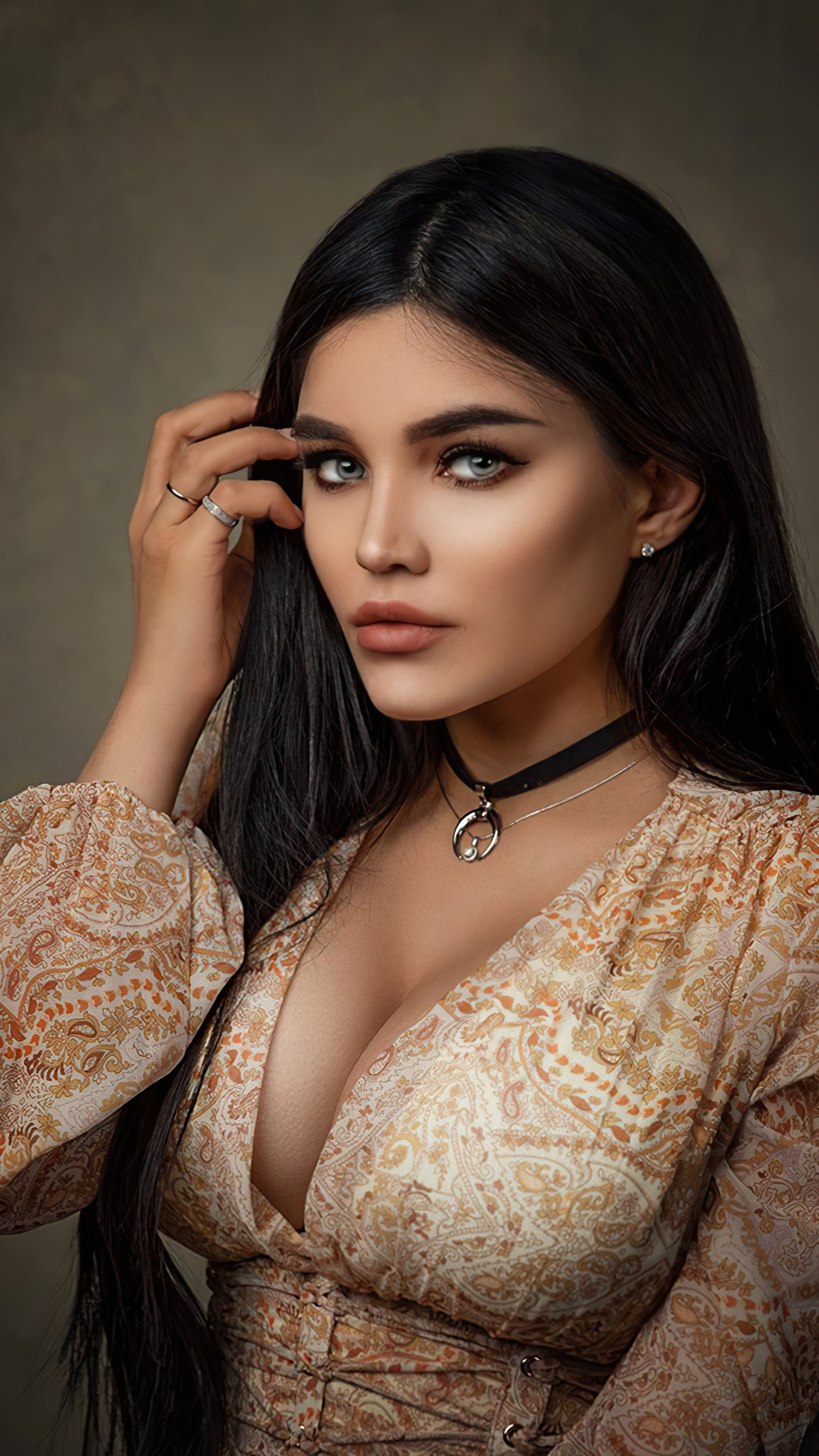 Woman with dark hair and patterned dress HD Phone Wallpaper