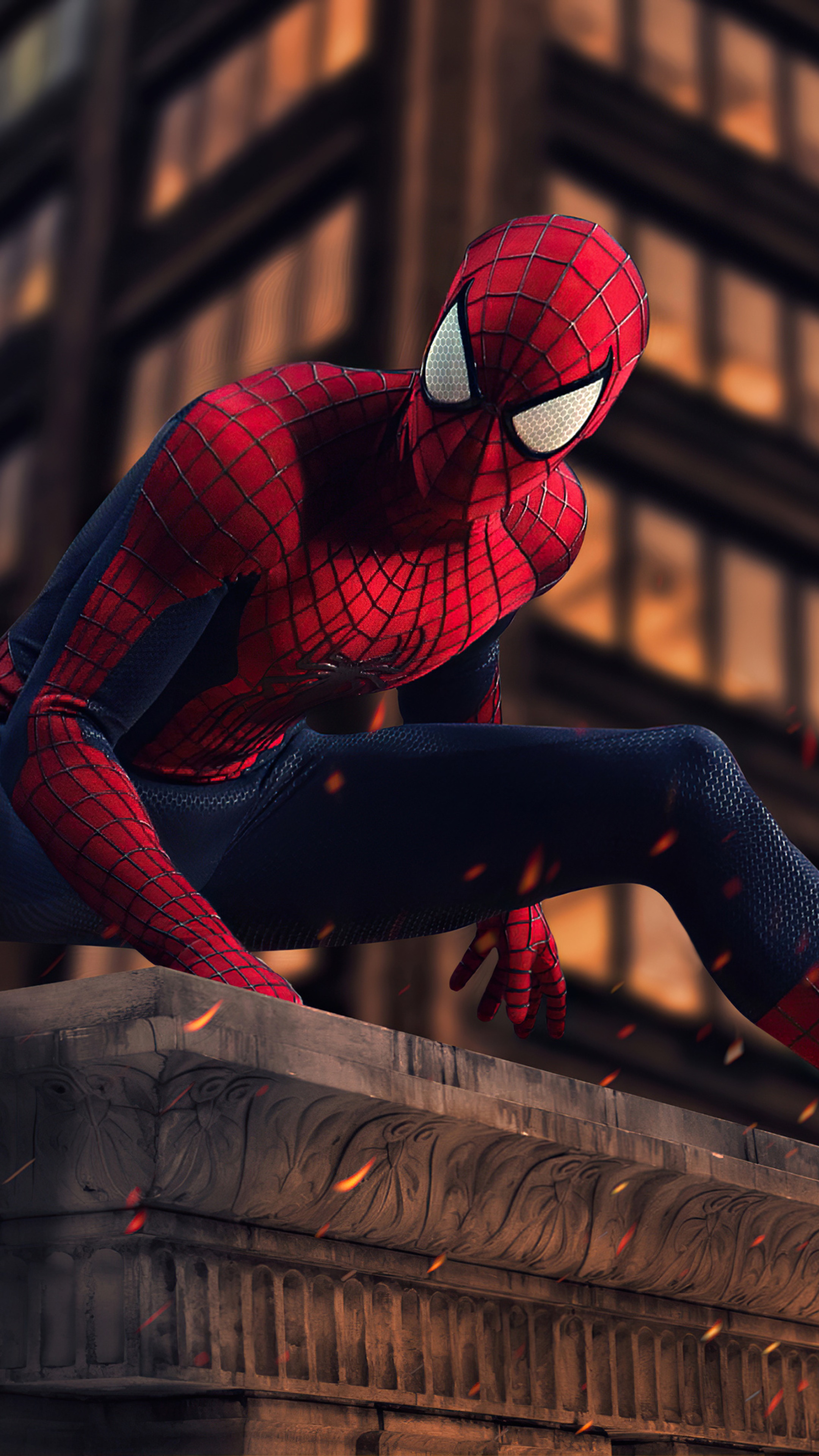 Spider-Man on a building ledge with fire HD Phone Wallpaper