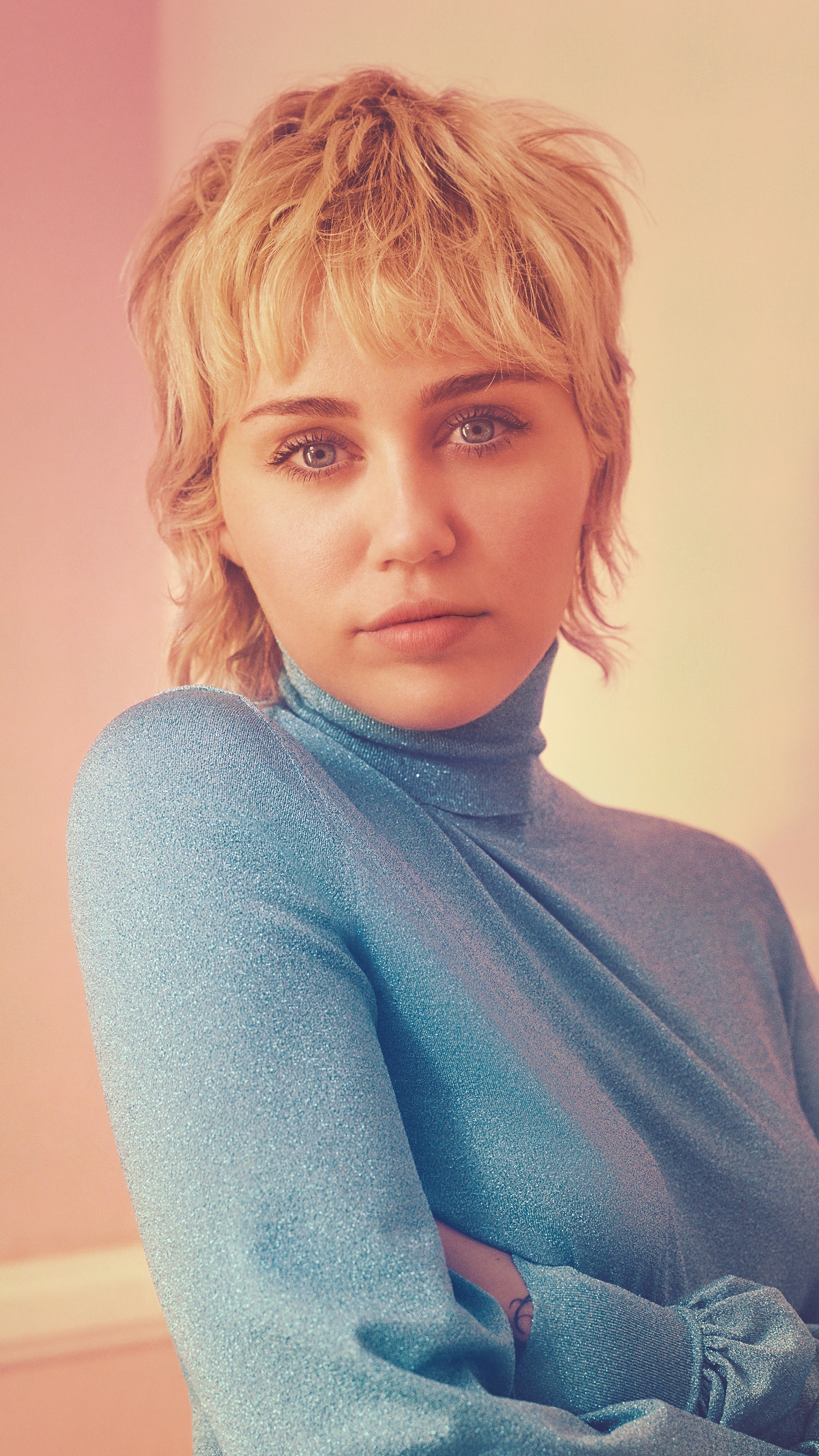 Miley Cyrus in a blue turtleneck HD Phone Wallpaper