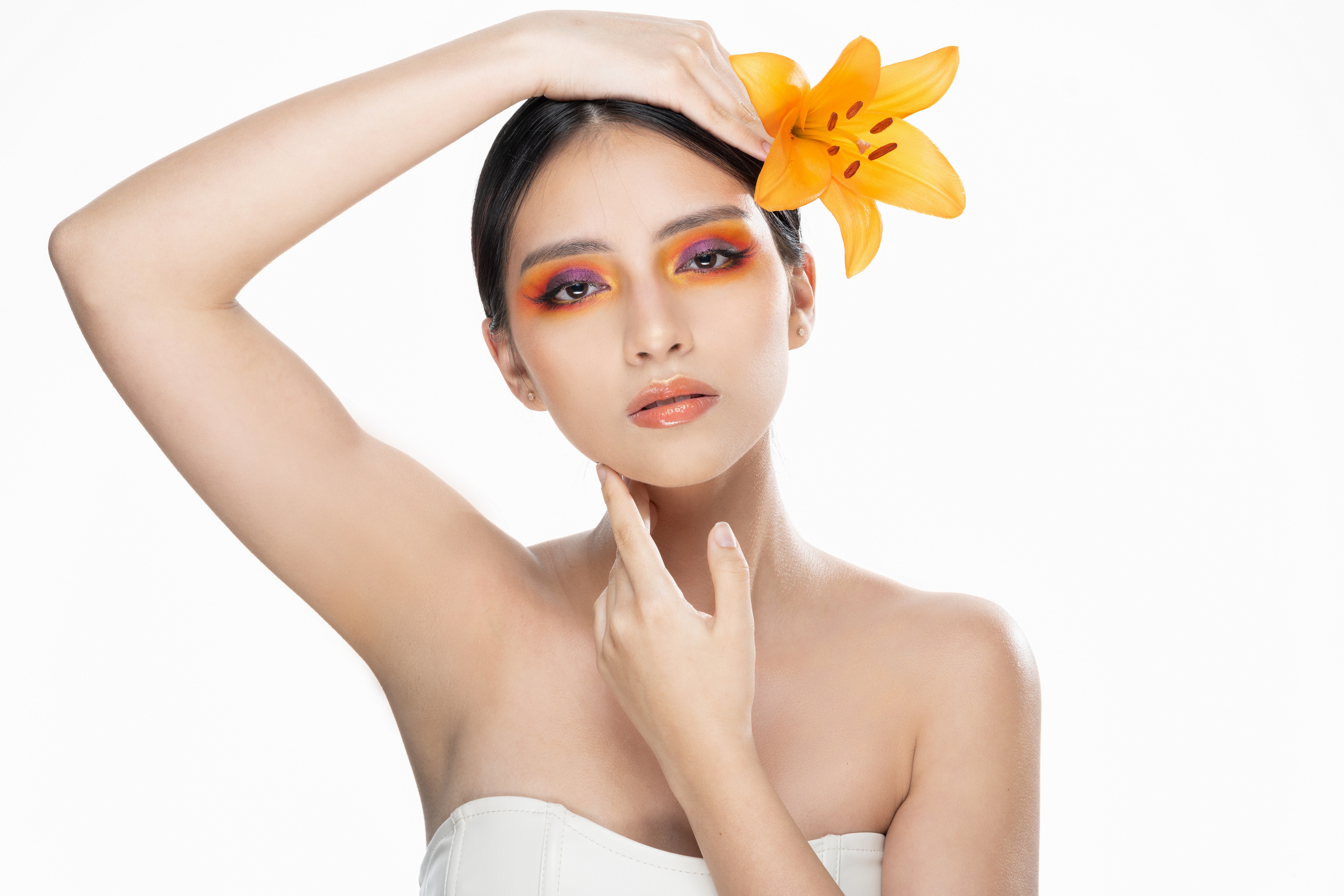 Brunette girl with orange lily and makeup HD Wallpaper