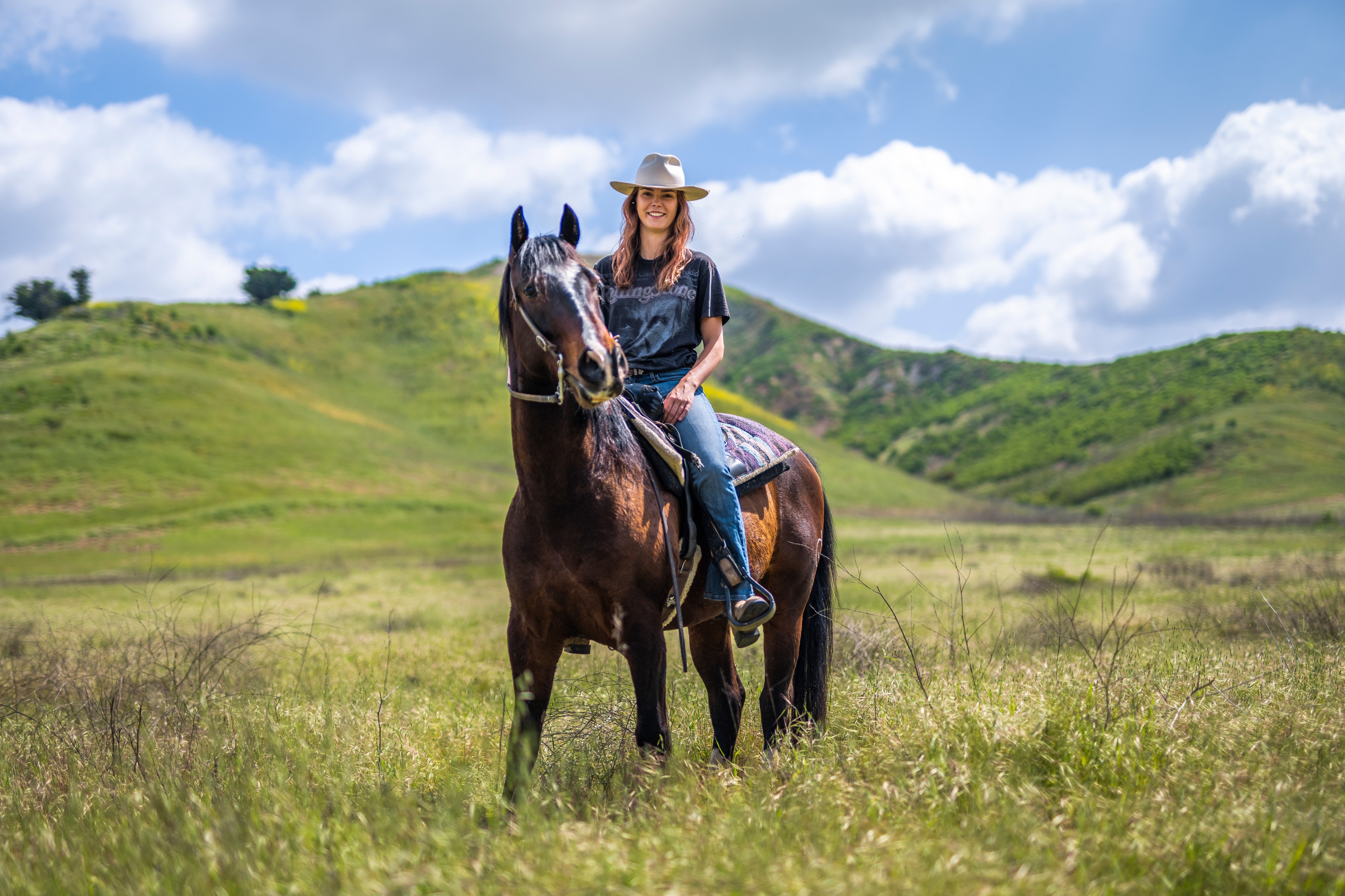 Woman in Cowboy Hat Riding a Horse HD Wallpaper