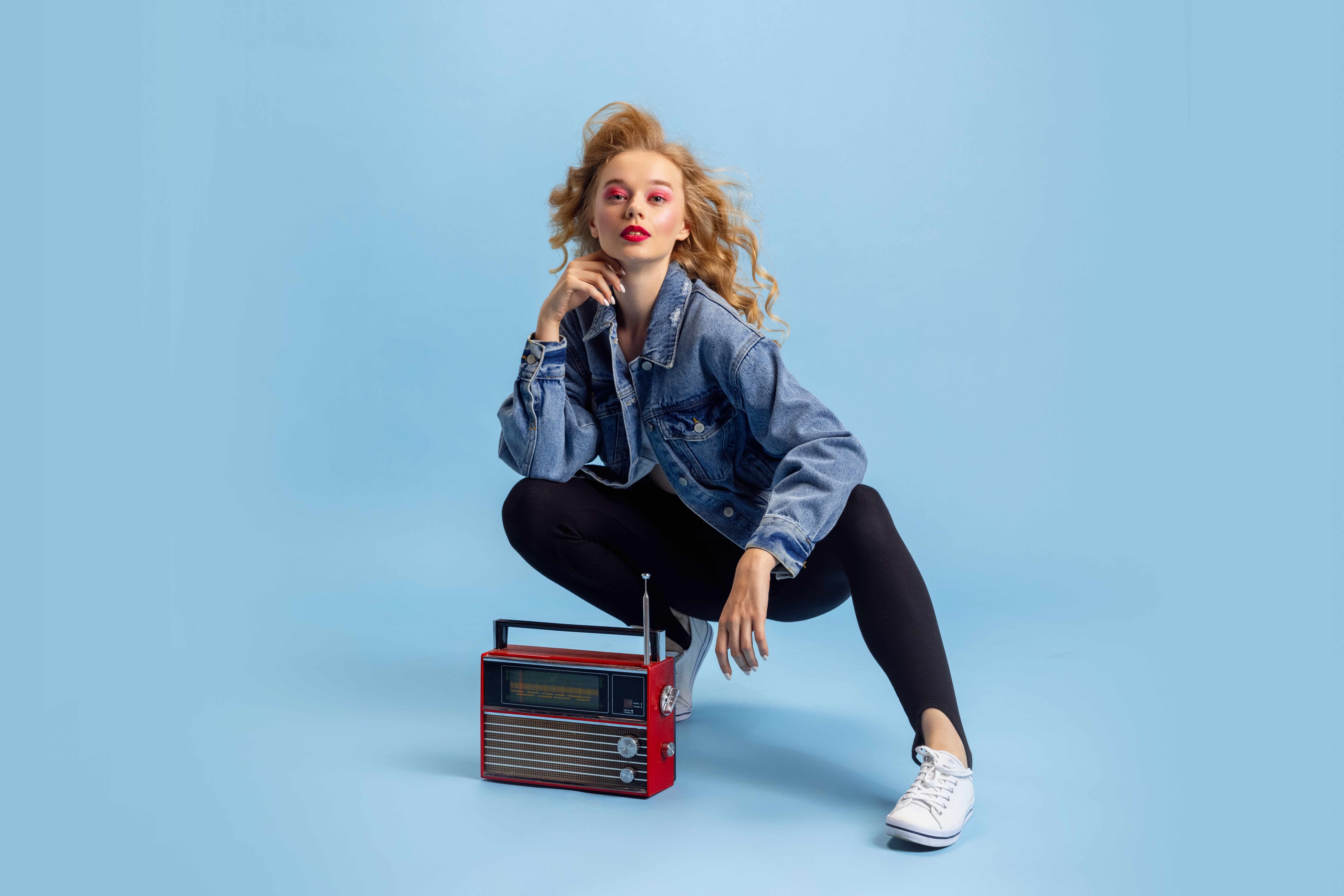 Woman in Denim Jacket with Vintage Radio HD Wallpaper