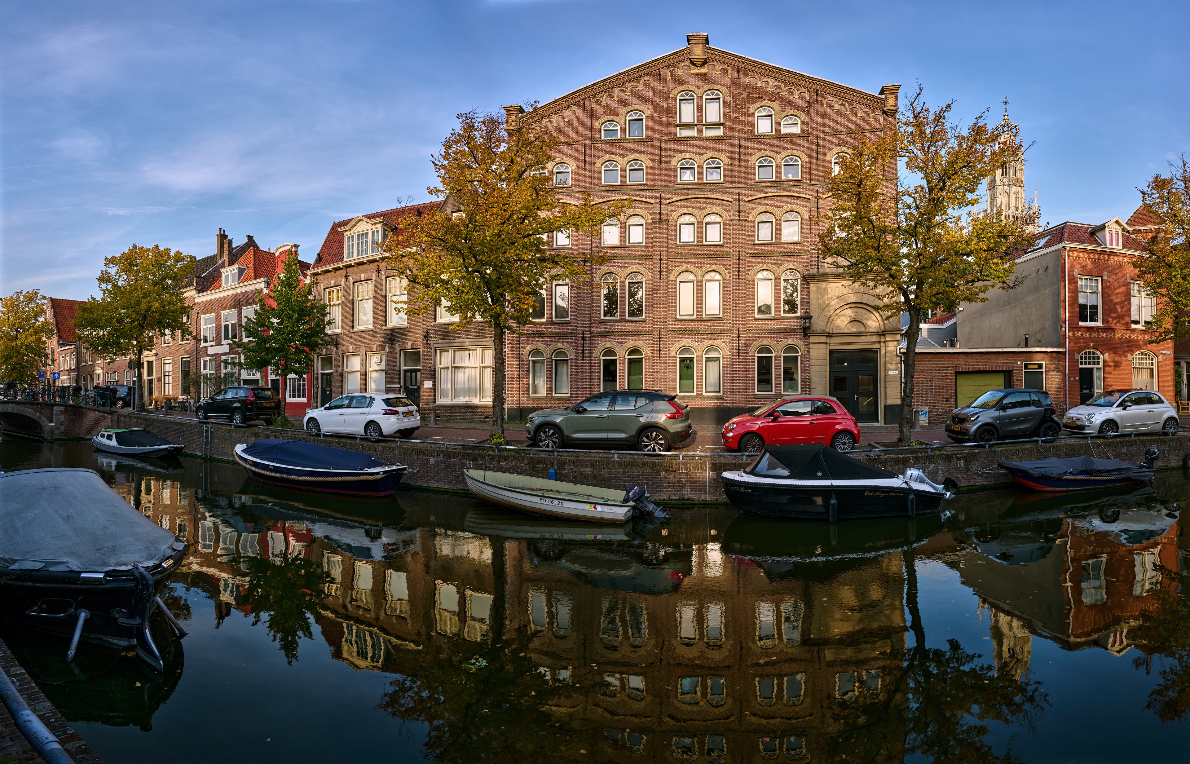 Canal in Haarlem, Netherlands with Houses and Boats HD Wallpaper