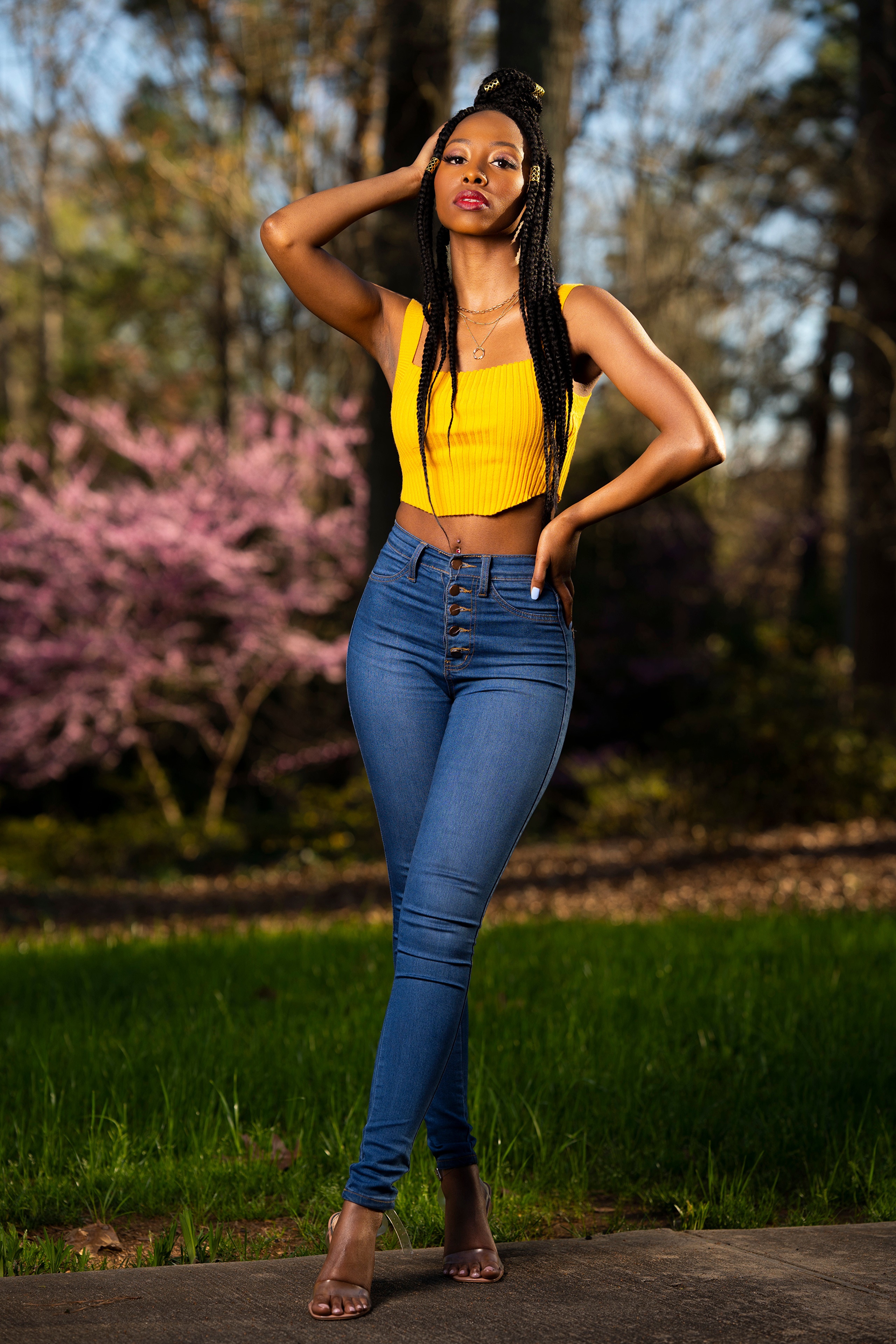 Woman with braids in yellow crop top and jeans HD Phone Wallpaper