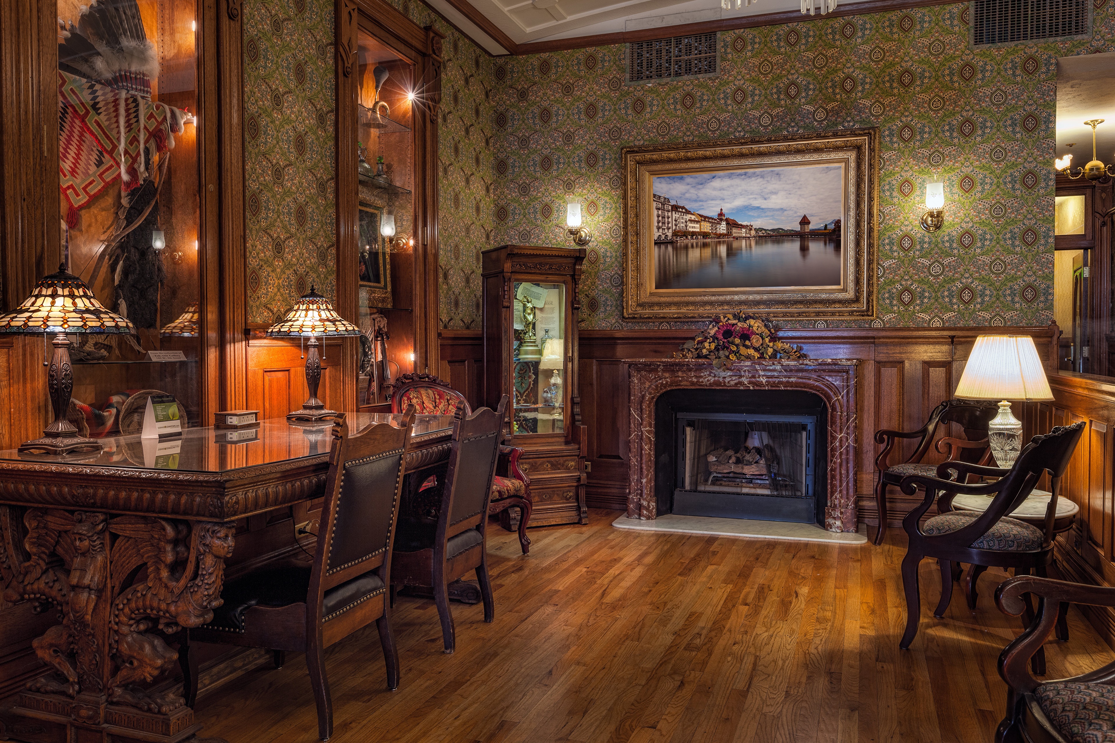 Interior of a room with a desk, fireplace, and chairs HD Wallpaper