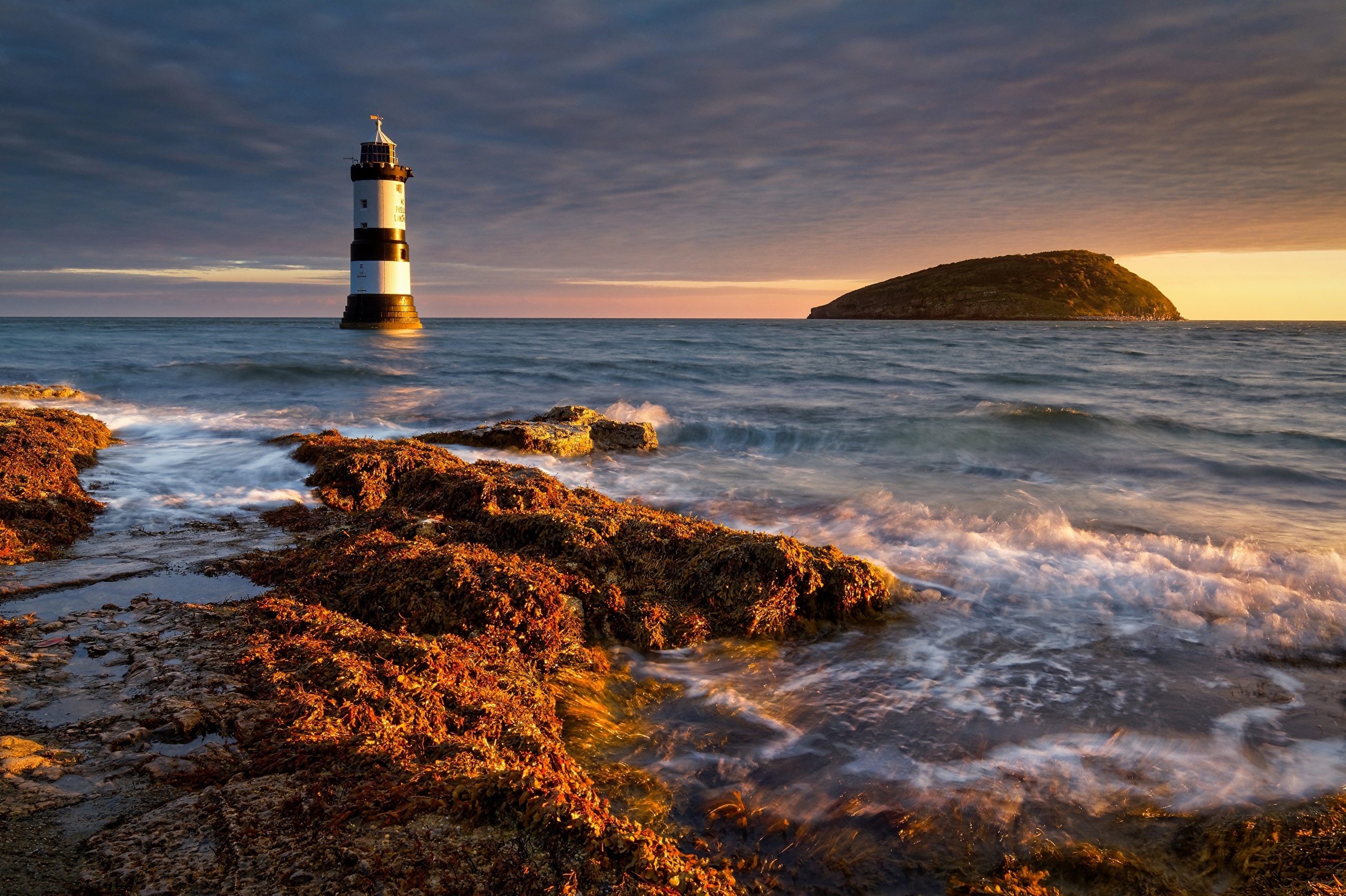 Penmon Lighthouse and Puffin Island at sunset HD Wallpaper
