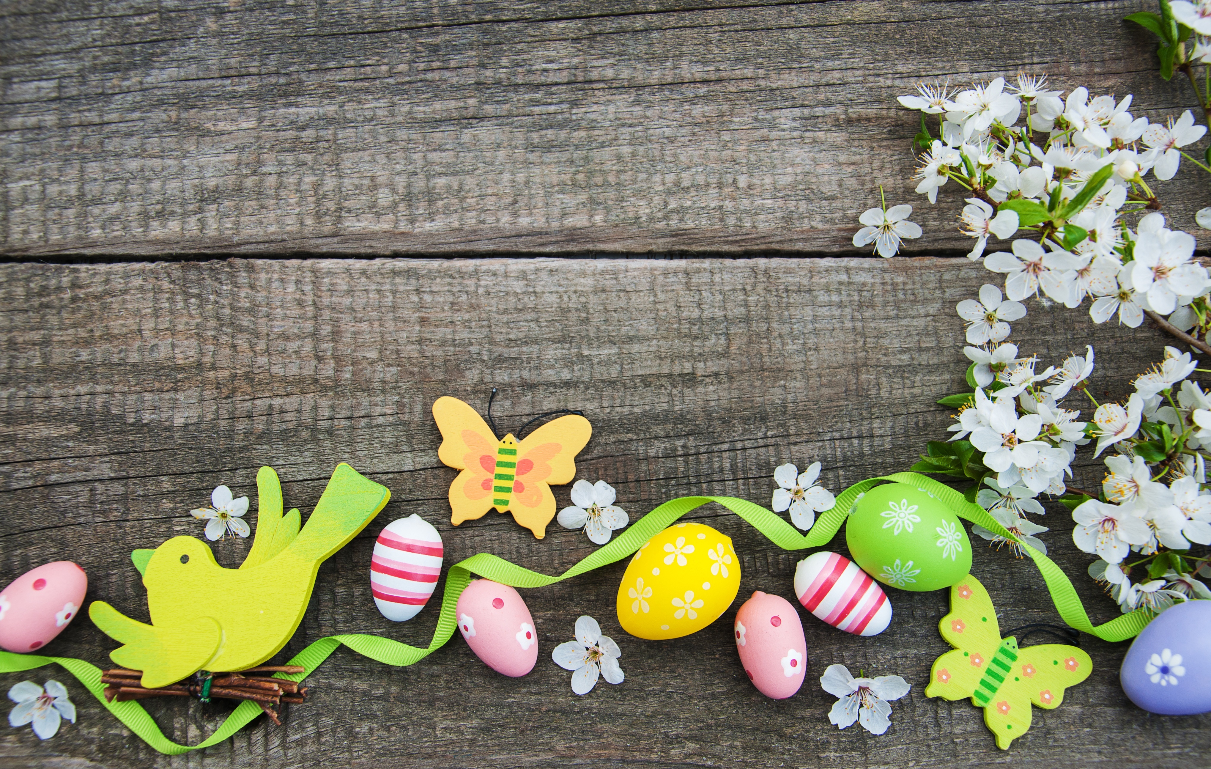 Easter eggs and decorations on wooden background HD Wallpaper