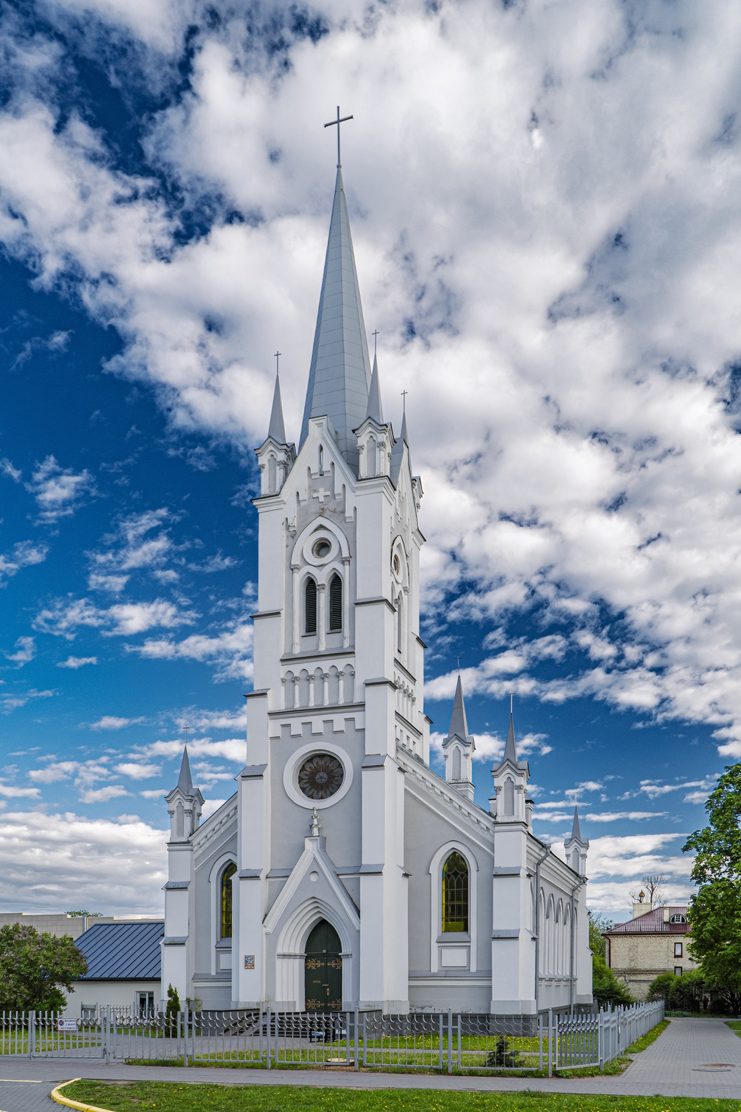 Church tower with cross in Grodno, Belarus under clouds HD Phone Wallpaper