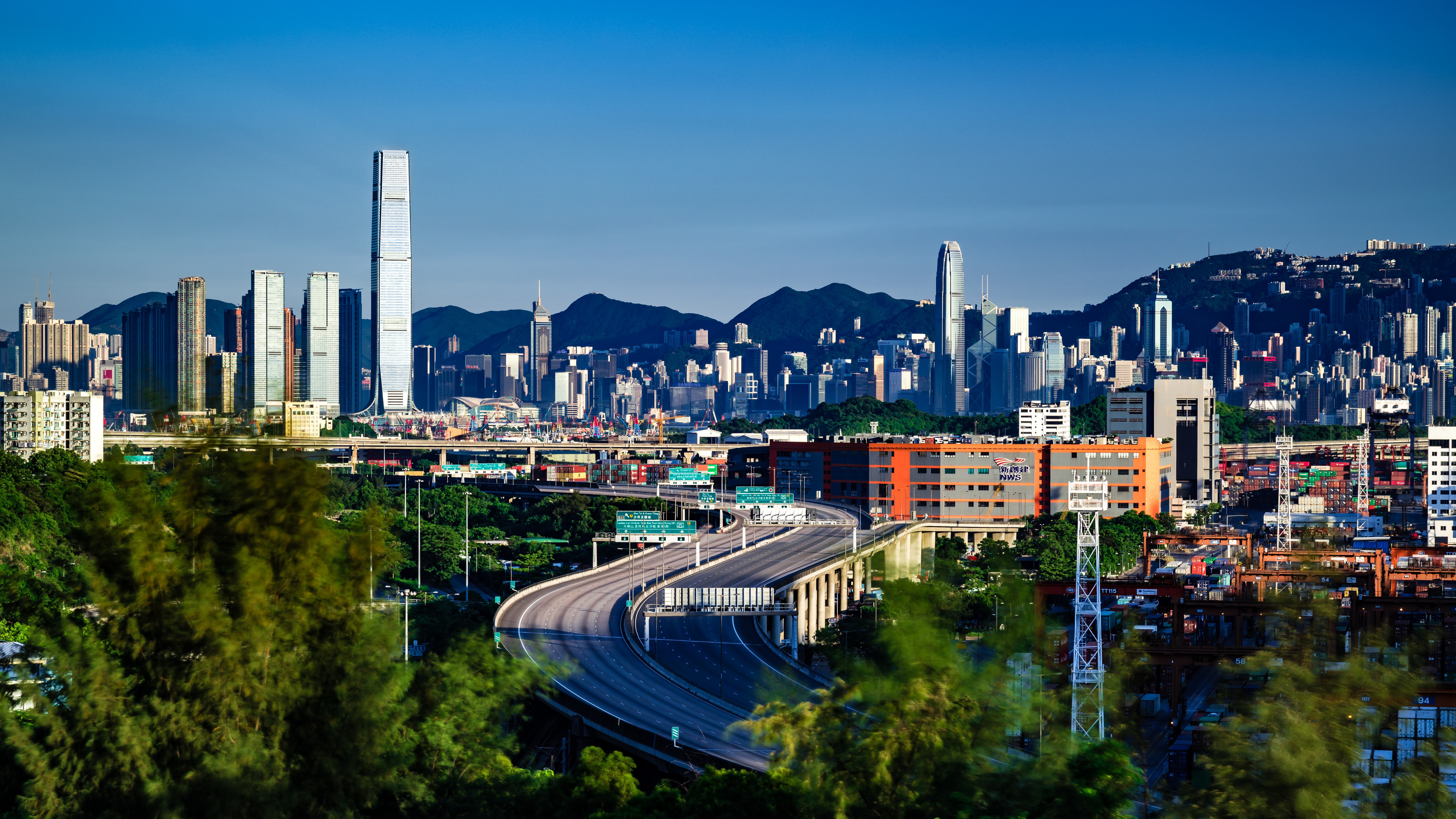 Hong Kong Skyline with Mountains and Roads HD Wallpaper