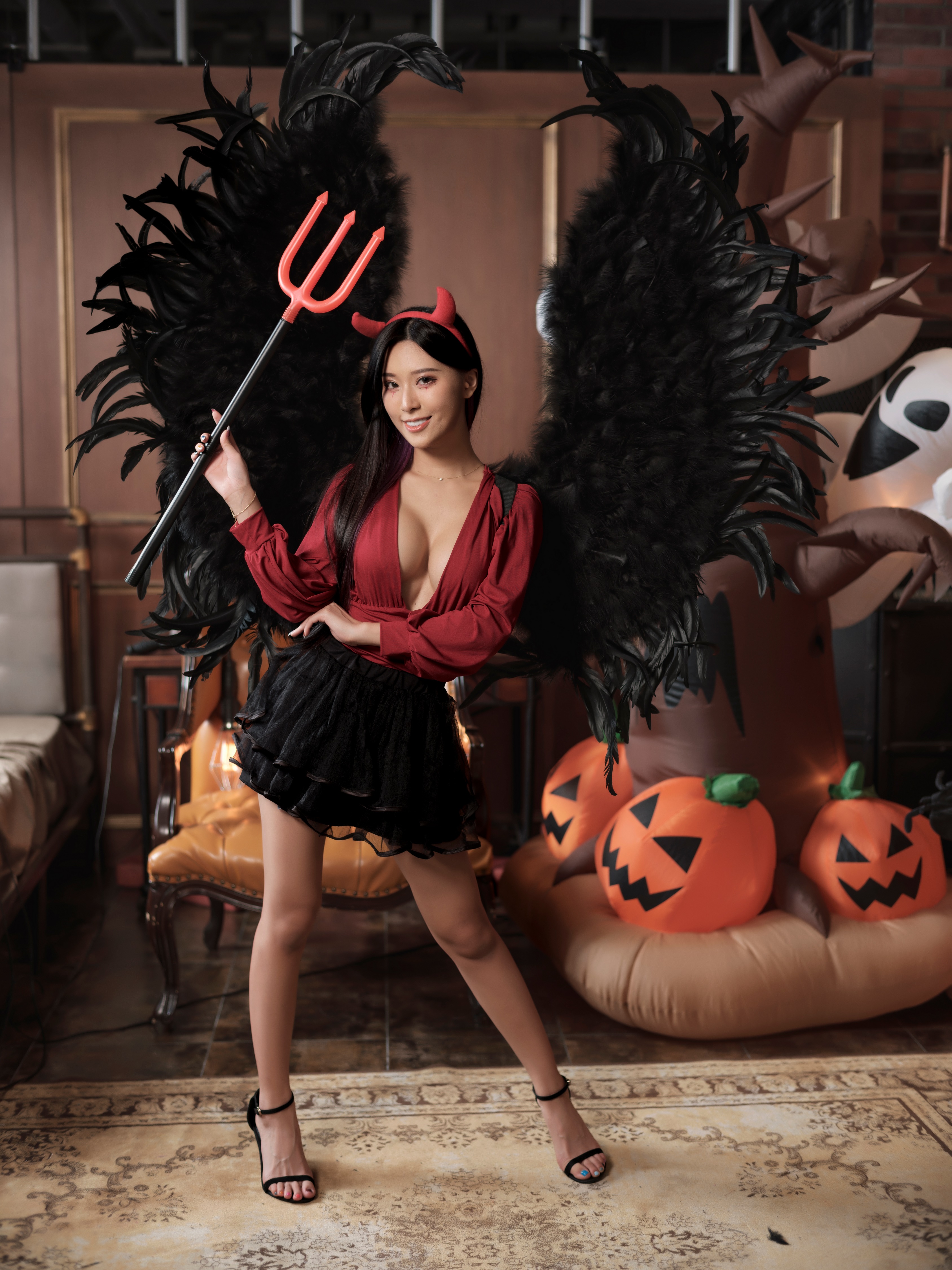 Woman in Devil Costume with Wings and Trident HD Phone Wallpaper