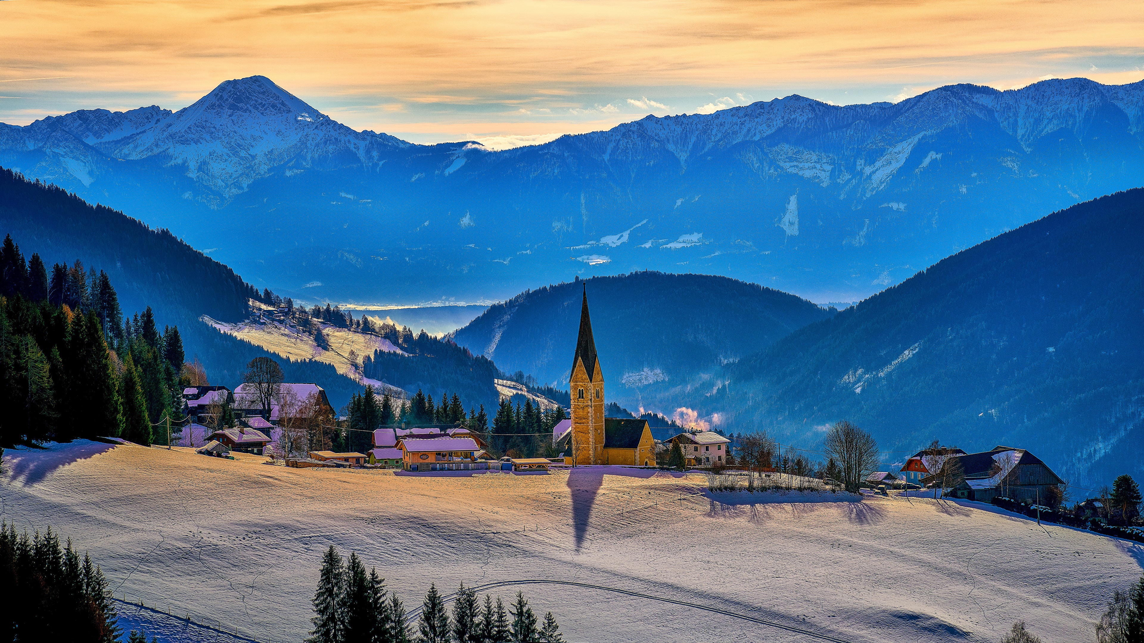 Snowy Austrian Alps village with church and mountains HD Wallpaper