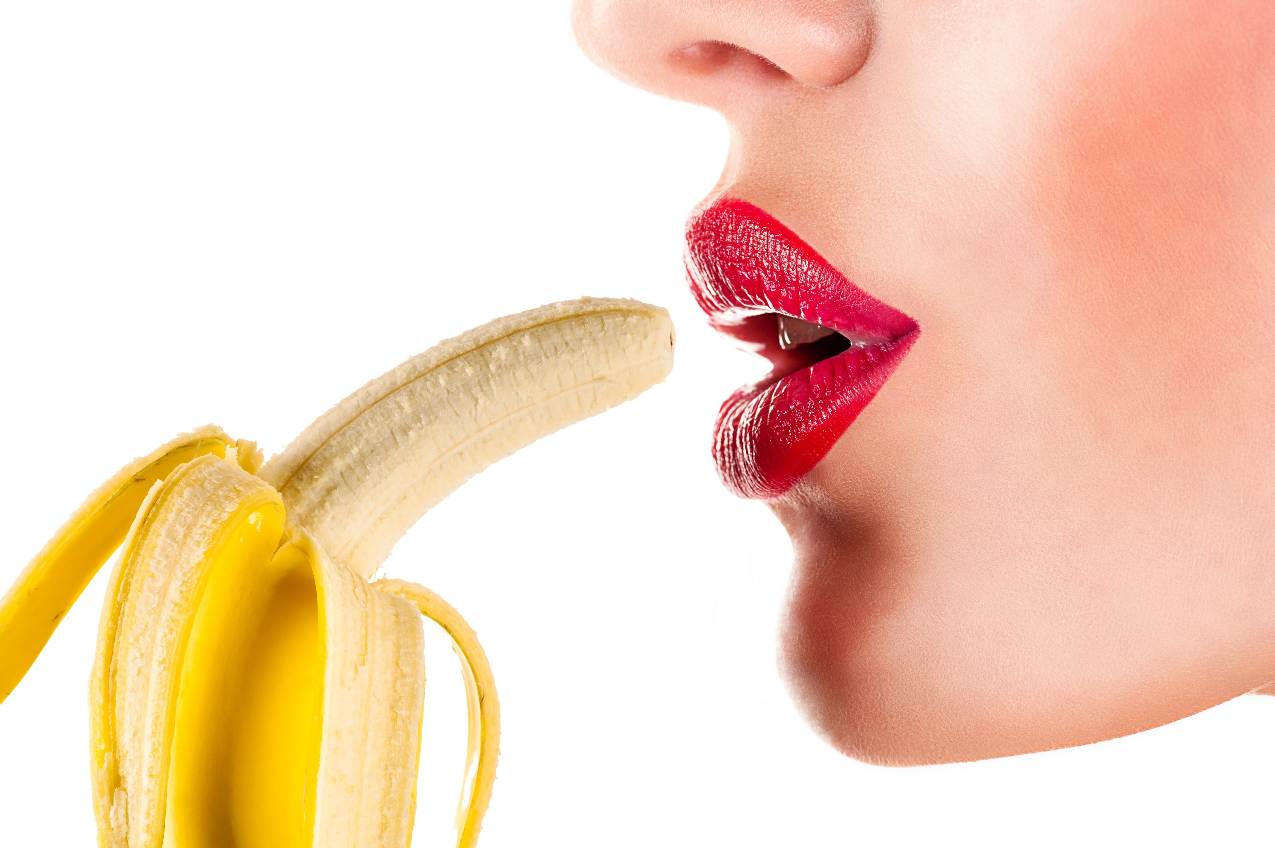 Woman with red lips eating a banana HD Wallpaper
