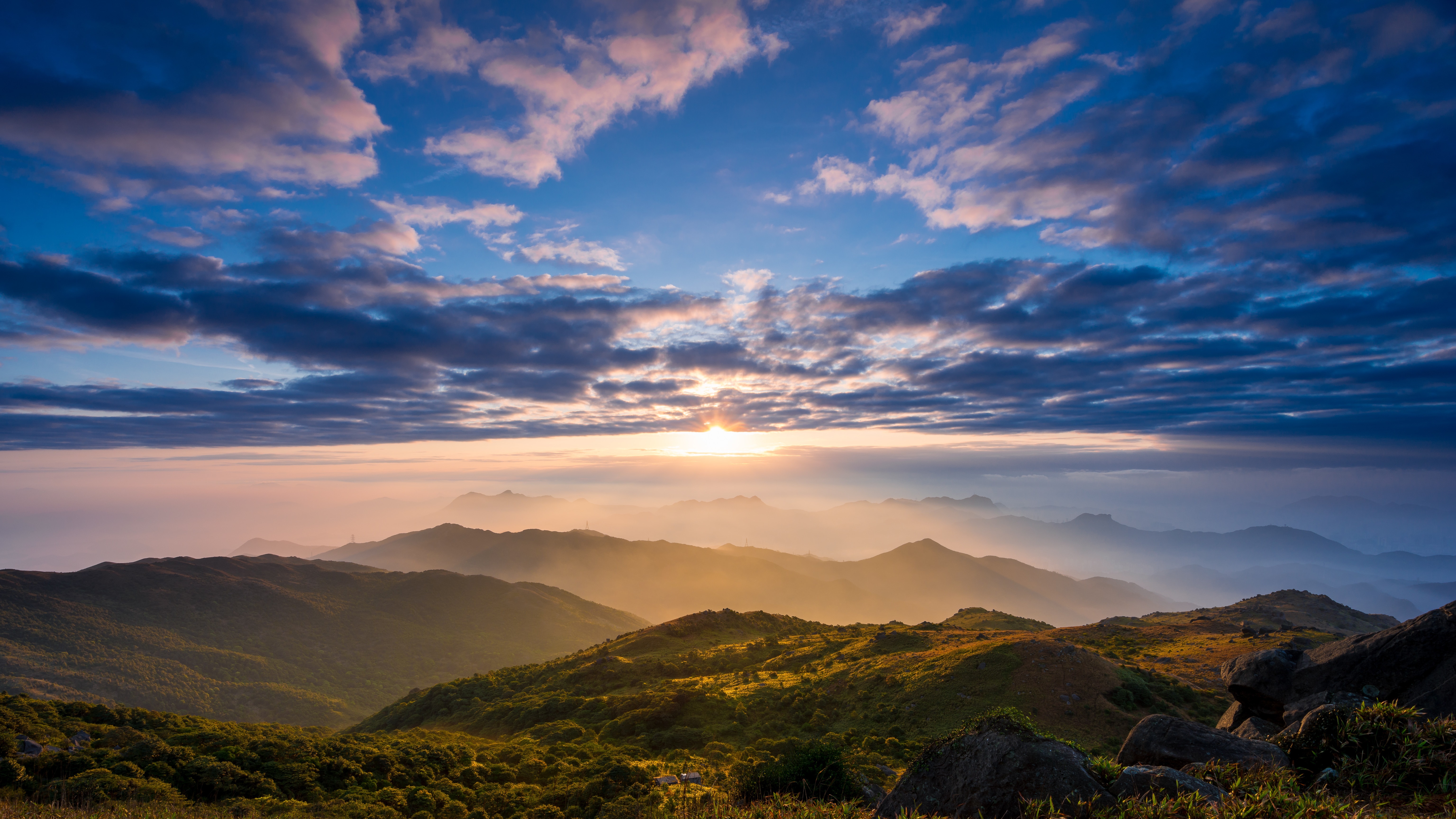 Sunrise over misty mountains in Hong Kong HD Wallpaper
