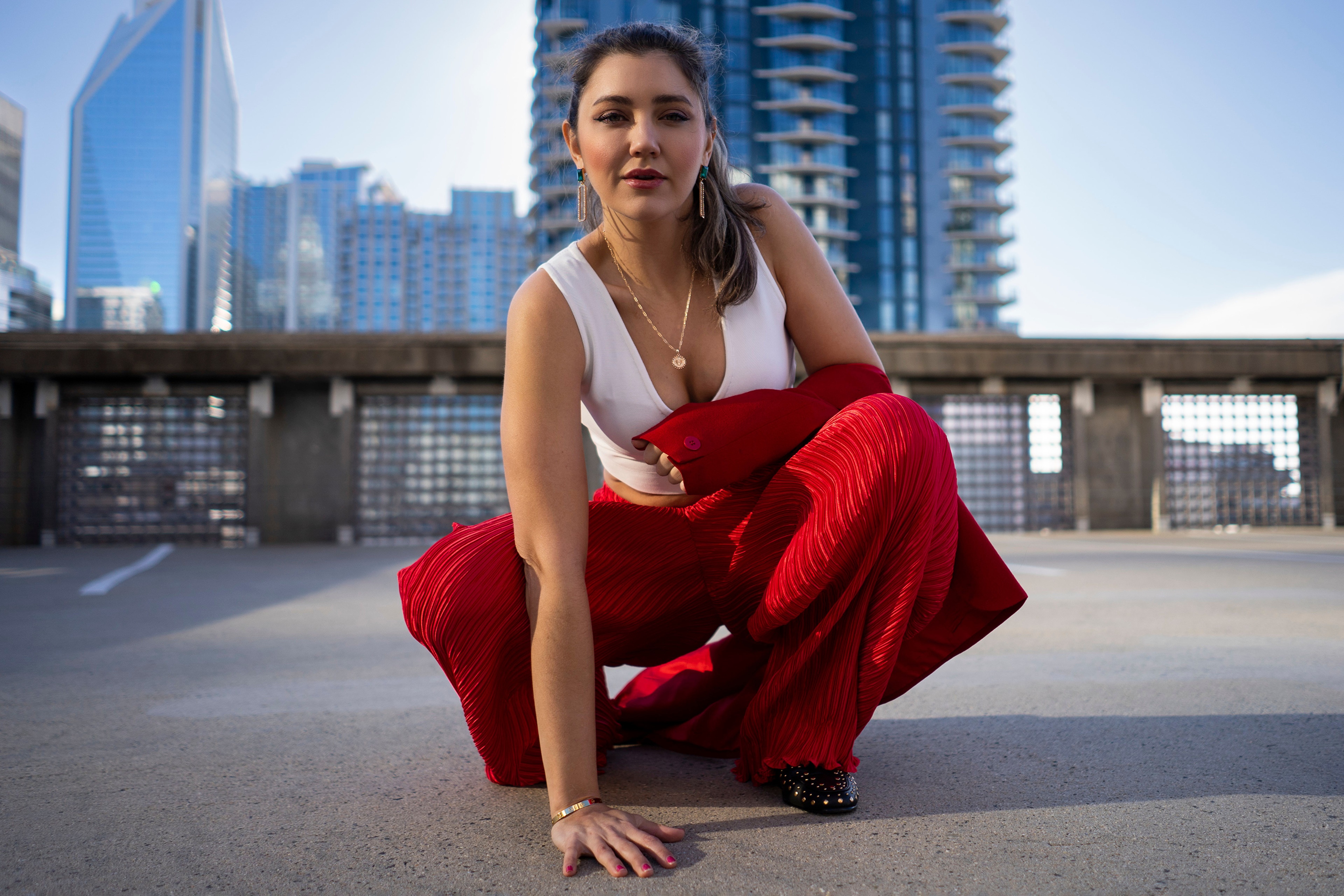 Tania d'Anconia posing in red trousers HD Wallpaper