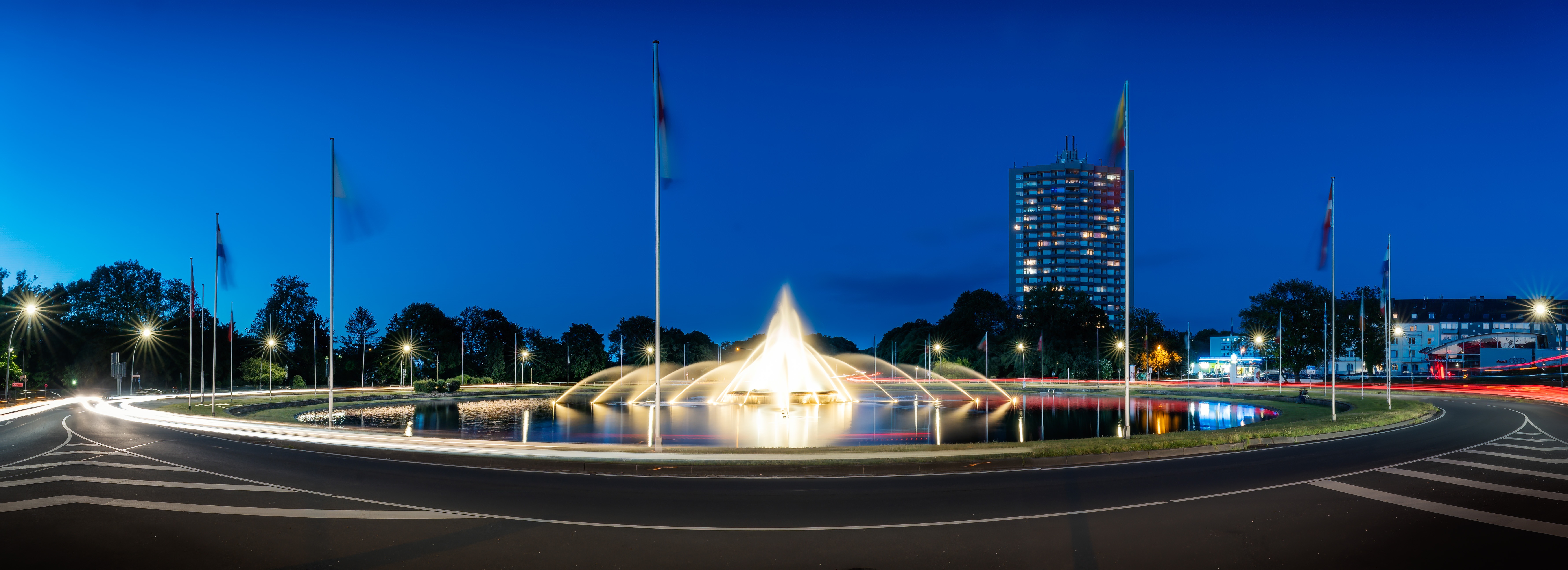 Panorama of a fountain and building in Aachen, Germany at night HD Wallpaper
