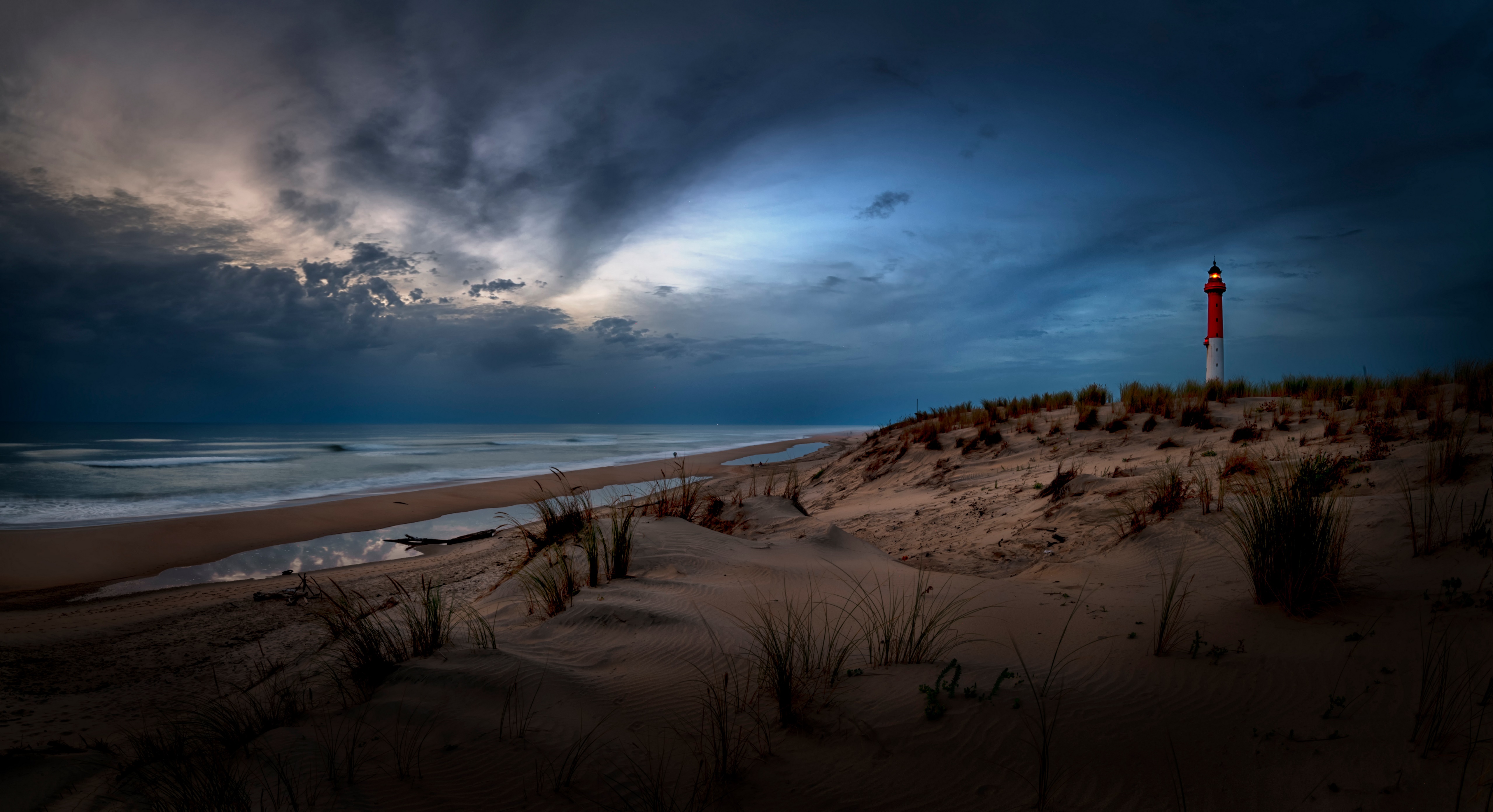 Lighthouse on sand dunes at La Palmyre, France HD Wallpaper