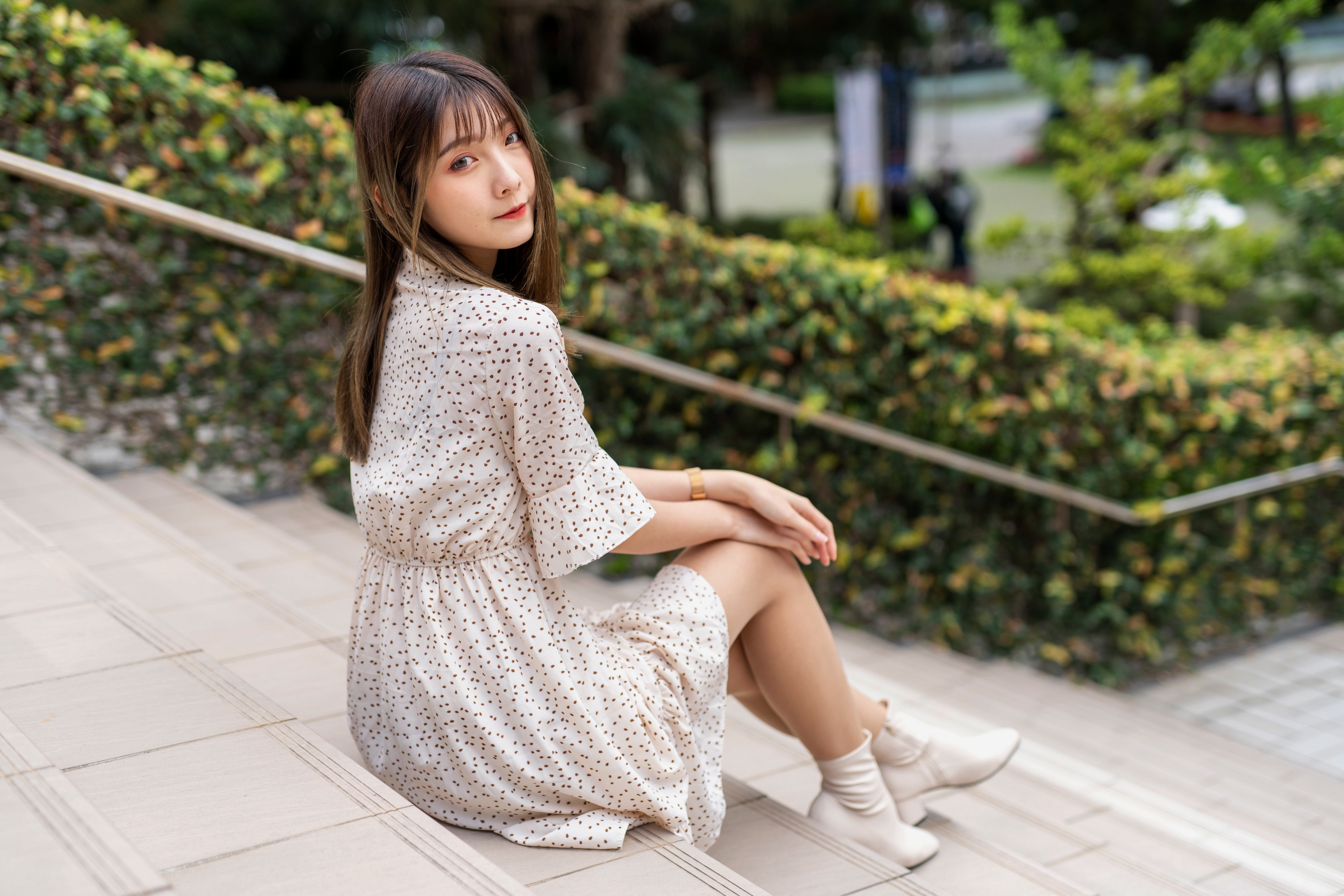 Asian woman sitting on stairs HD Wallpaper