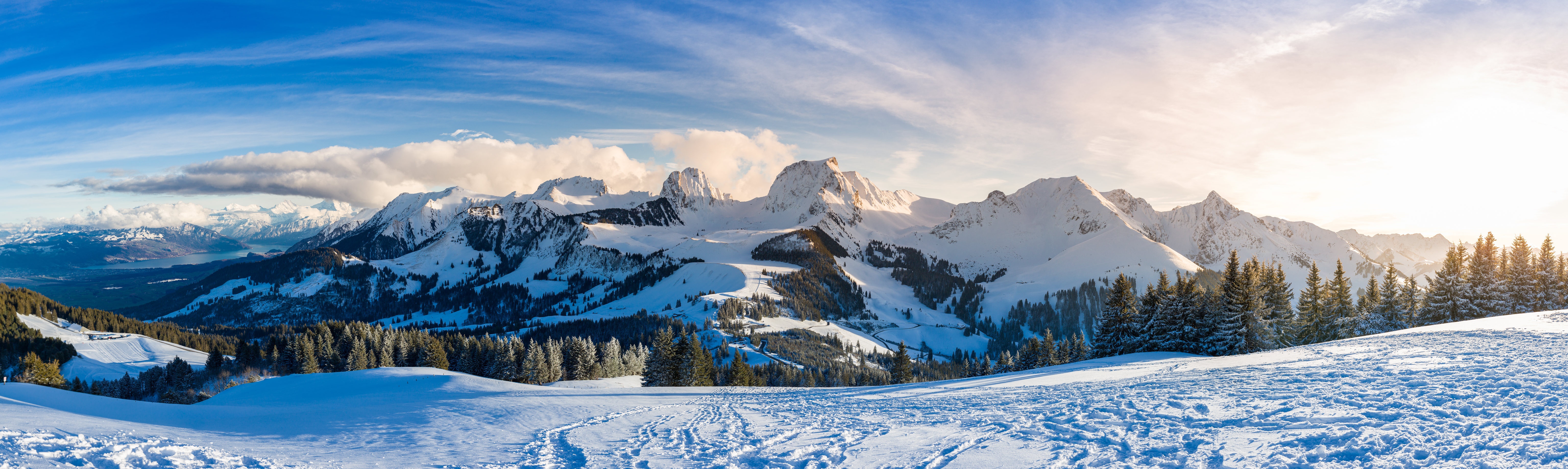 Panoramic view of snow-covered Gantrisch mountains in Switzerland HD Wallpaper