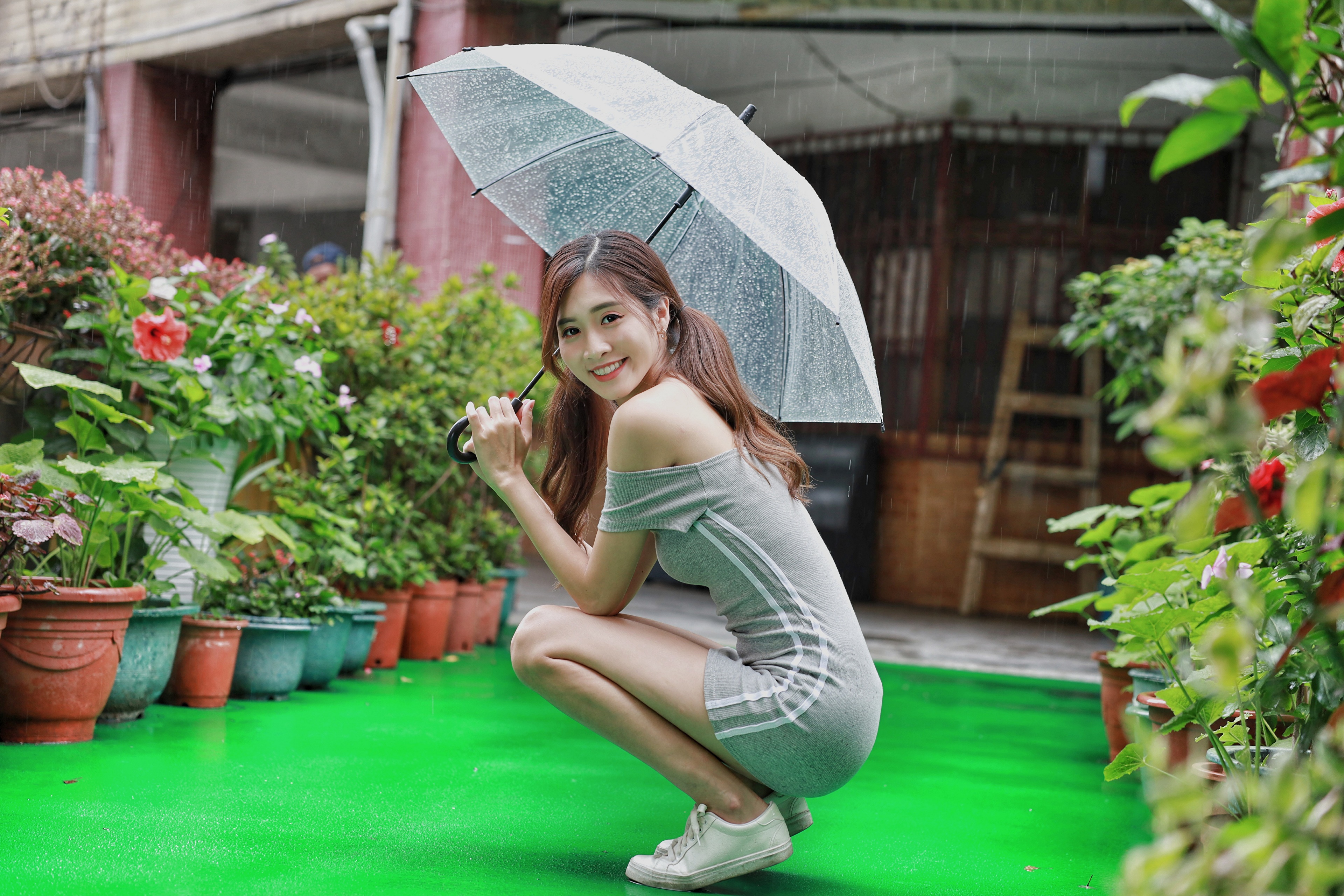 Asian Woman Posing with Umbrella in Rain HD Wallpaper