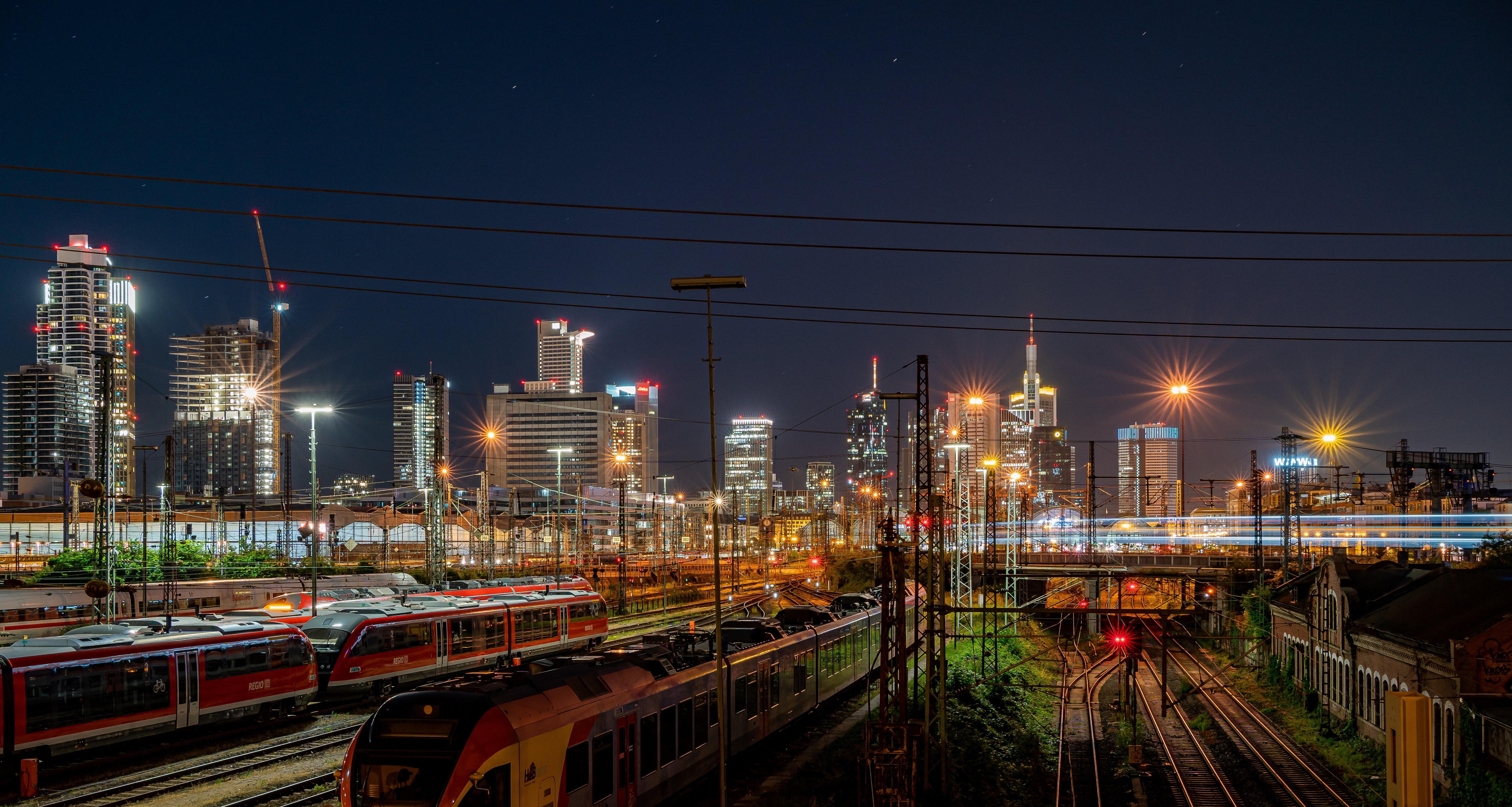 Frankfurt skyline at night with trains HD Wallpaper