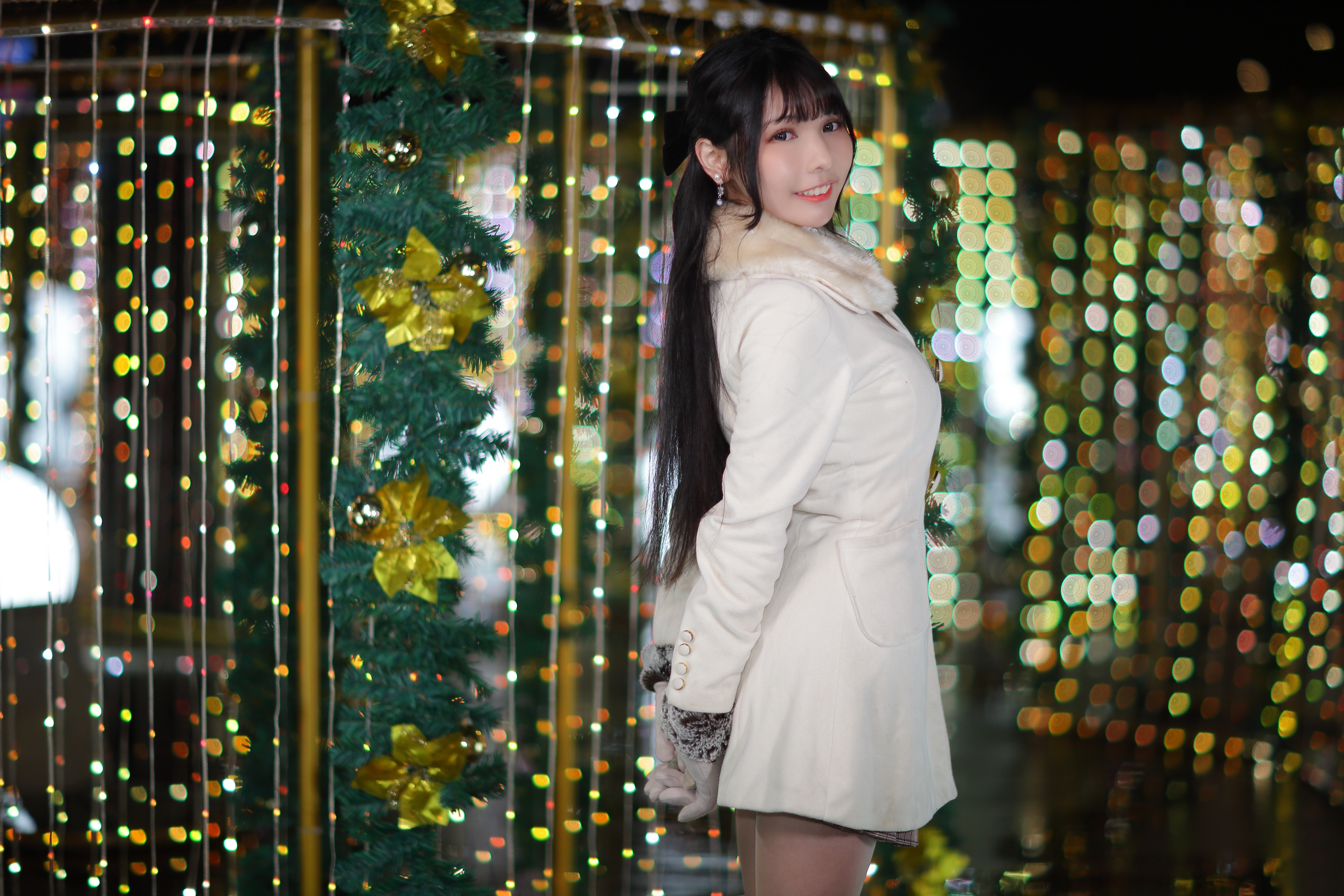 Brunette girl in a coat with Christmas lights HD Wallpaper