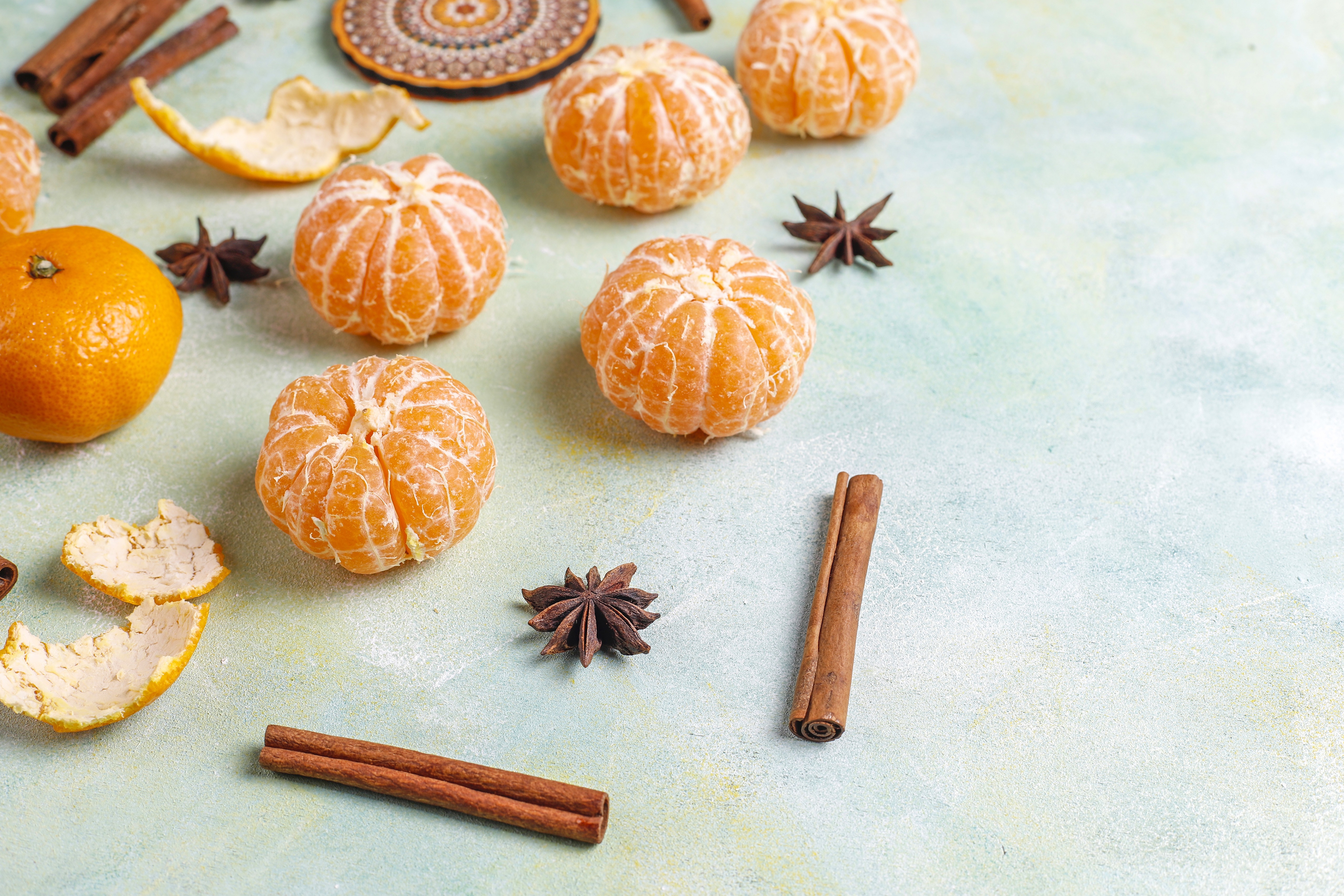 Mandarine, Cinnamon, and Star Anise on a Textured Surface HD Wallpaper