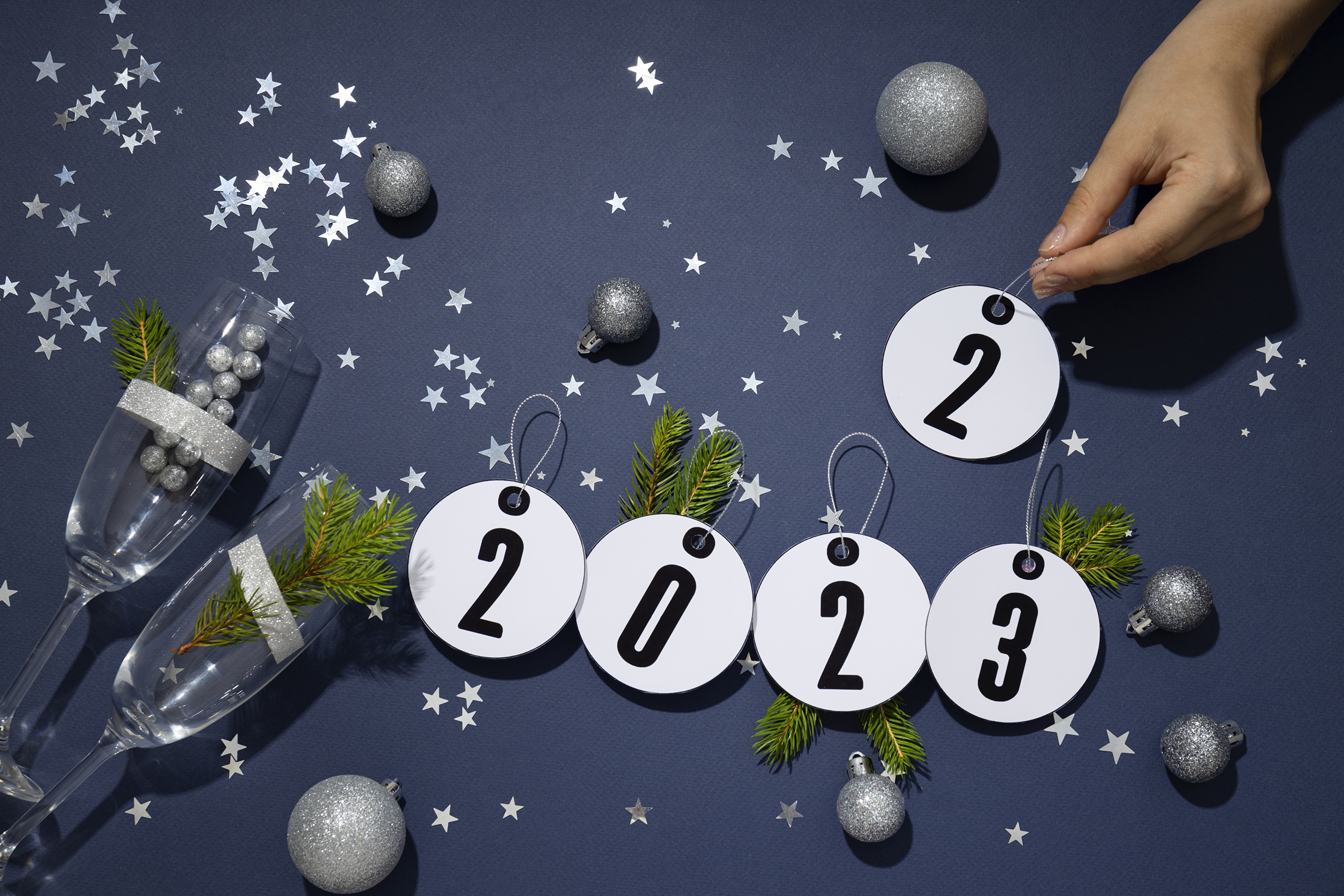 New Year 2023 Celebration with Champagne Glasses and Ornaments HD Wallpaper