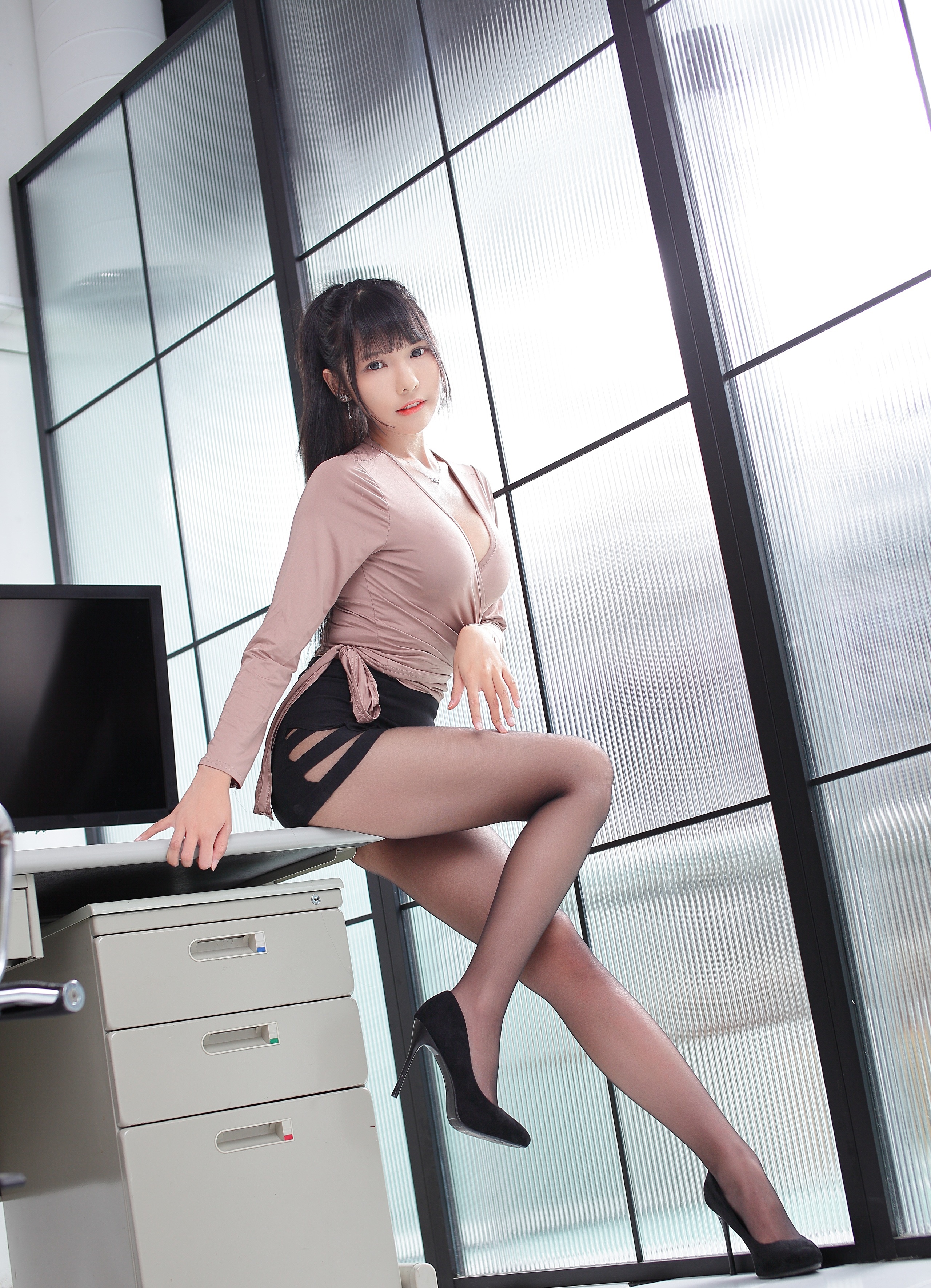 Asian woman in office attire posing near window HD Phone Wallpaper