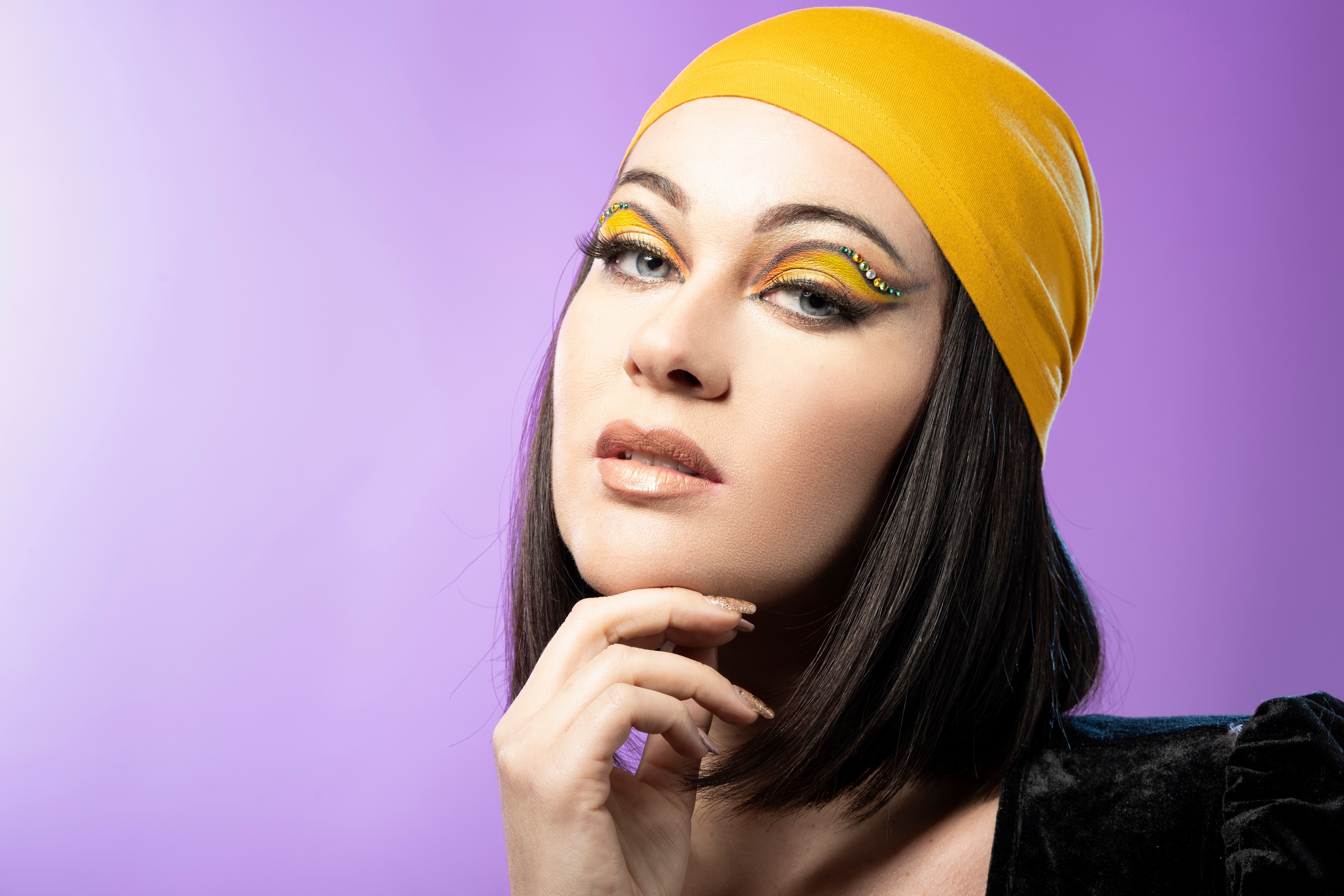 Woman with yellow headscarf and dramatic makeup HD Wallpaper