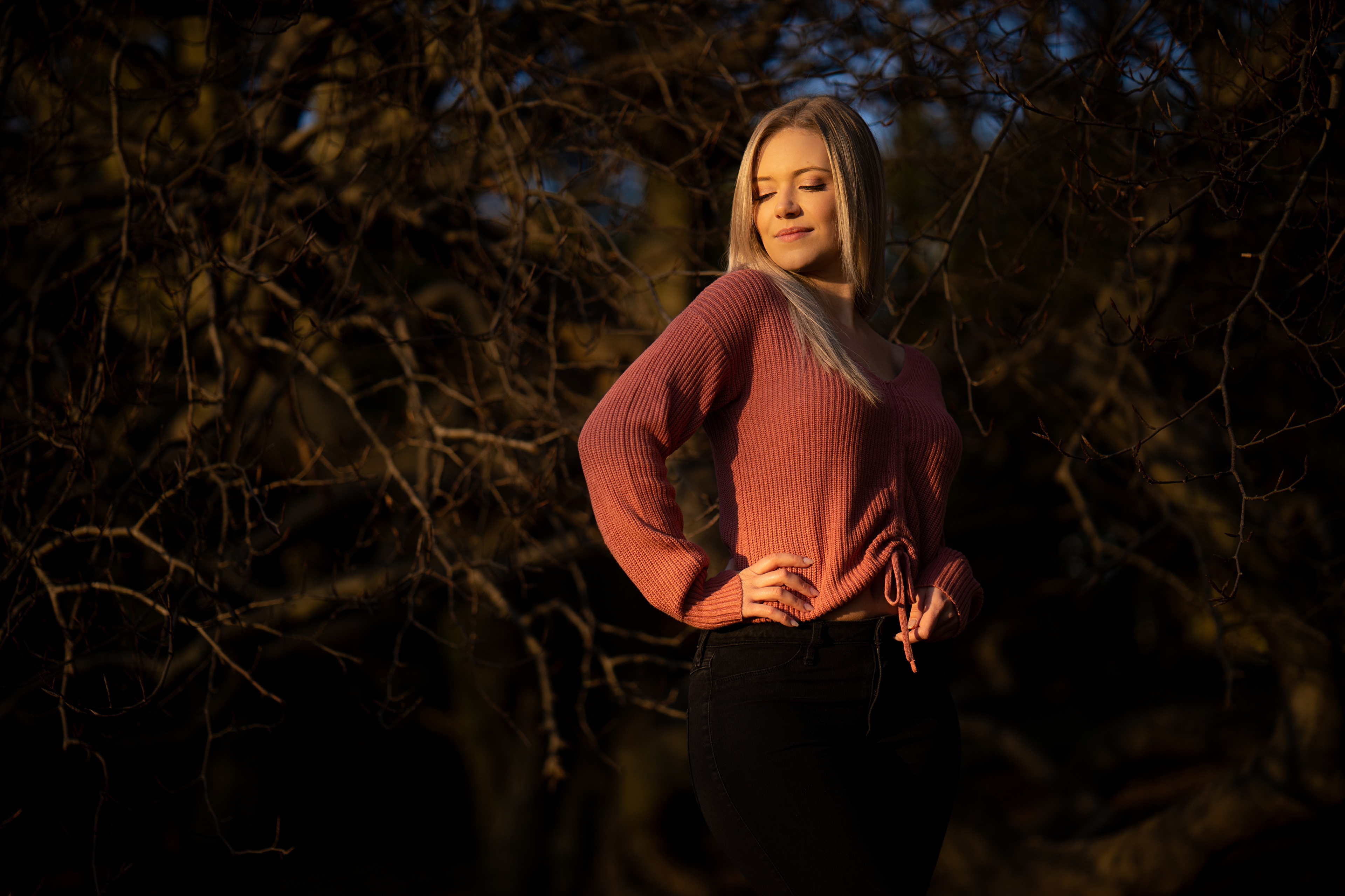 Blonde girl in sweater and jeans posing HD Wallpaper