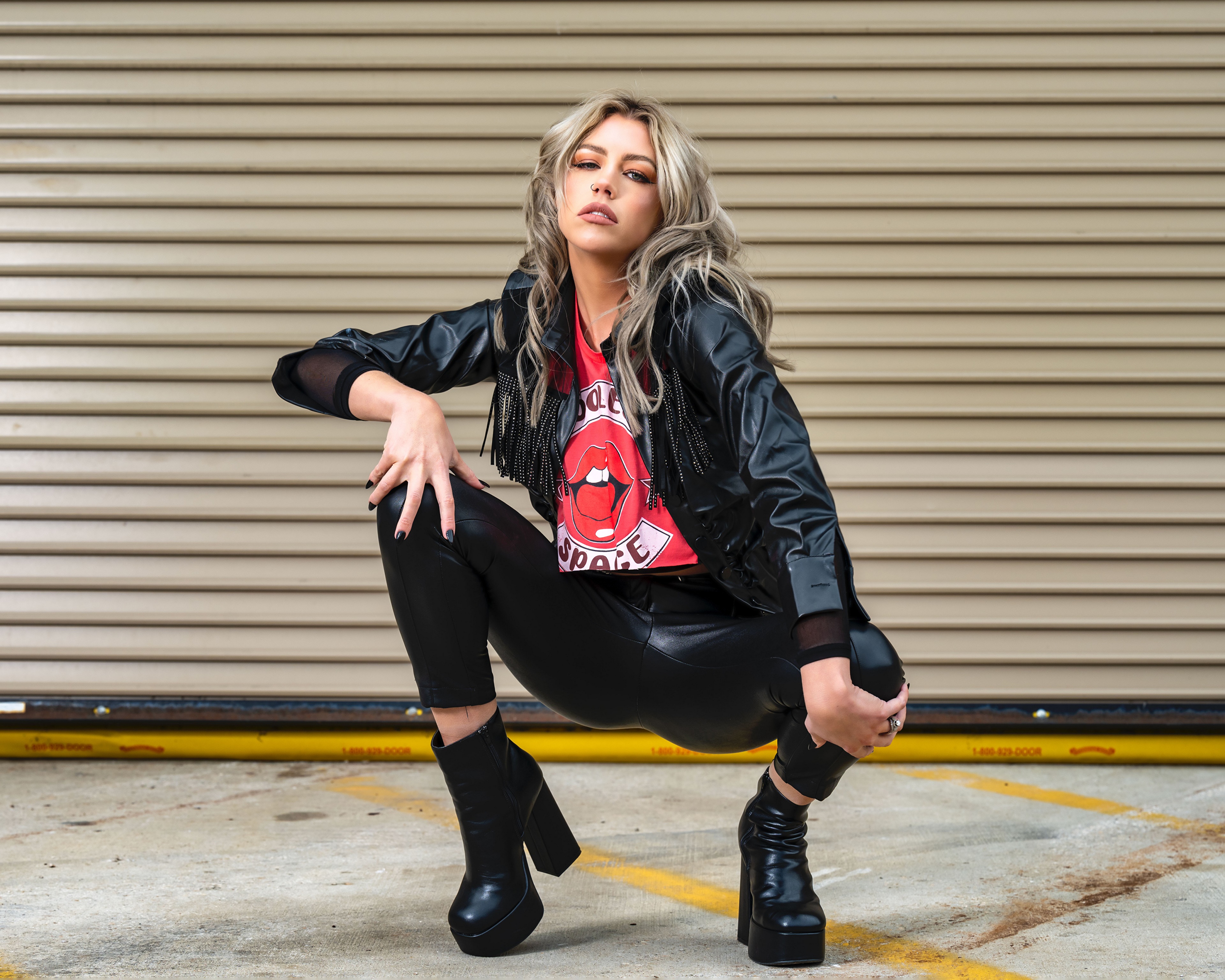 Jillian Lyle in a black jacket and boots HD Wallpaper
