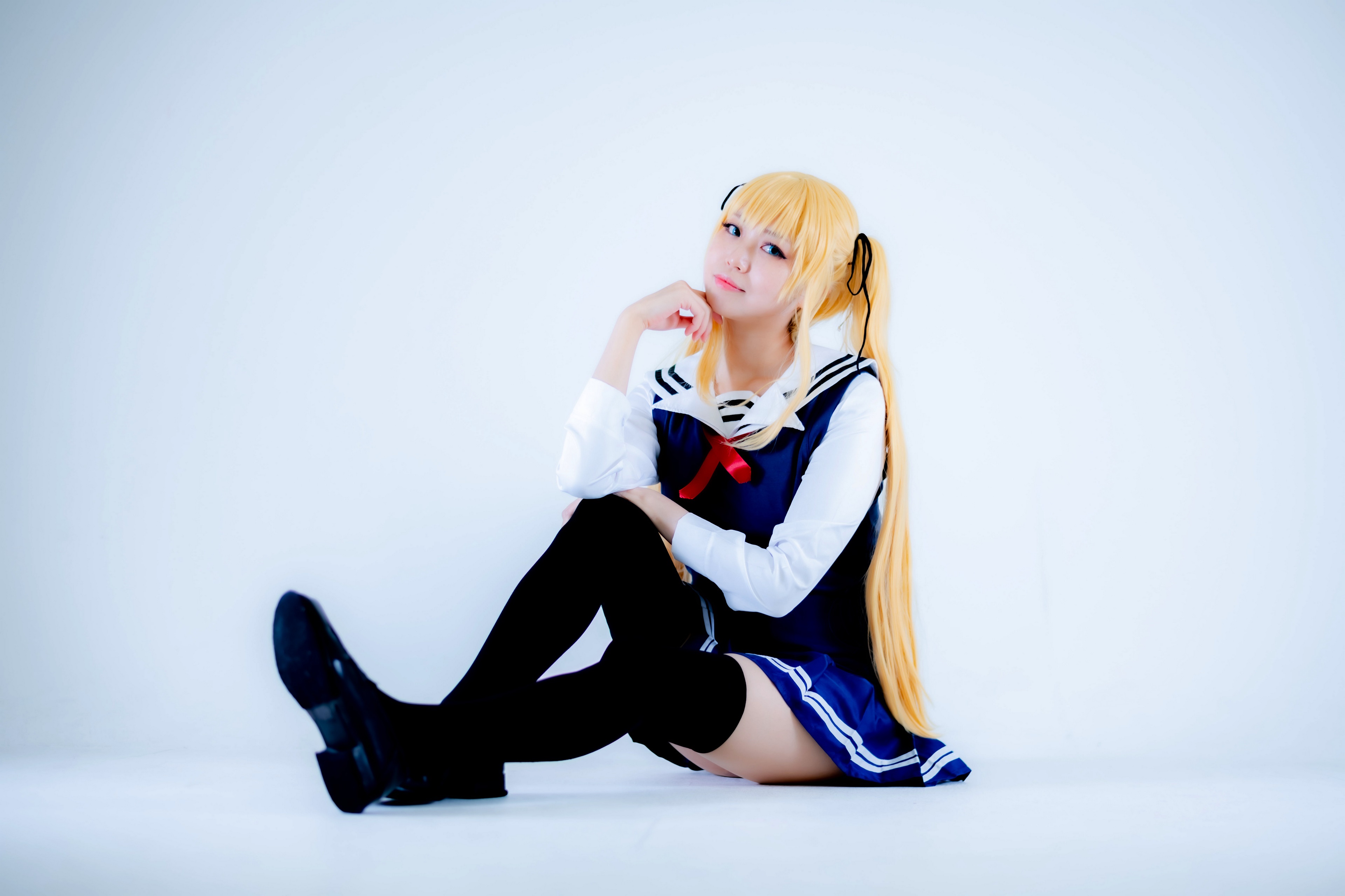 Blonde girl in school uniform sitting HD Wallpaper