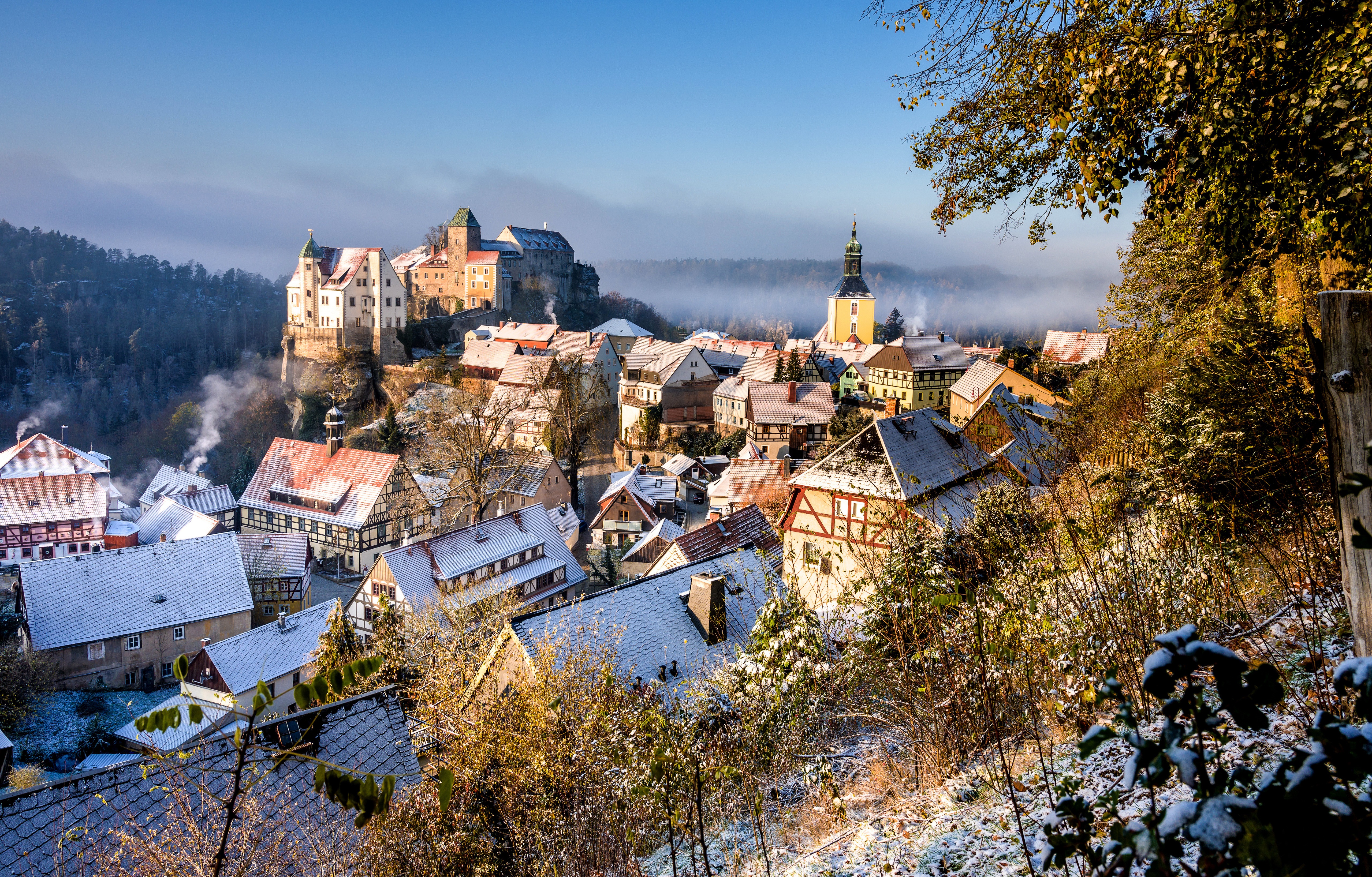 Hohnstein, Germany in Winter with Snow-Covered Houses and Castle HD Wallpaper