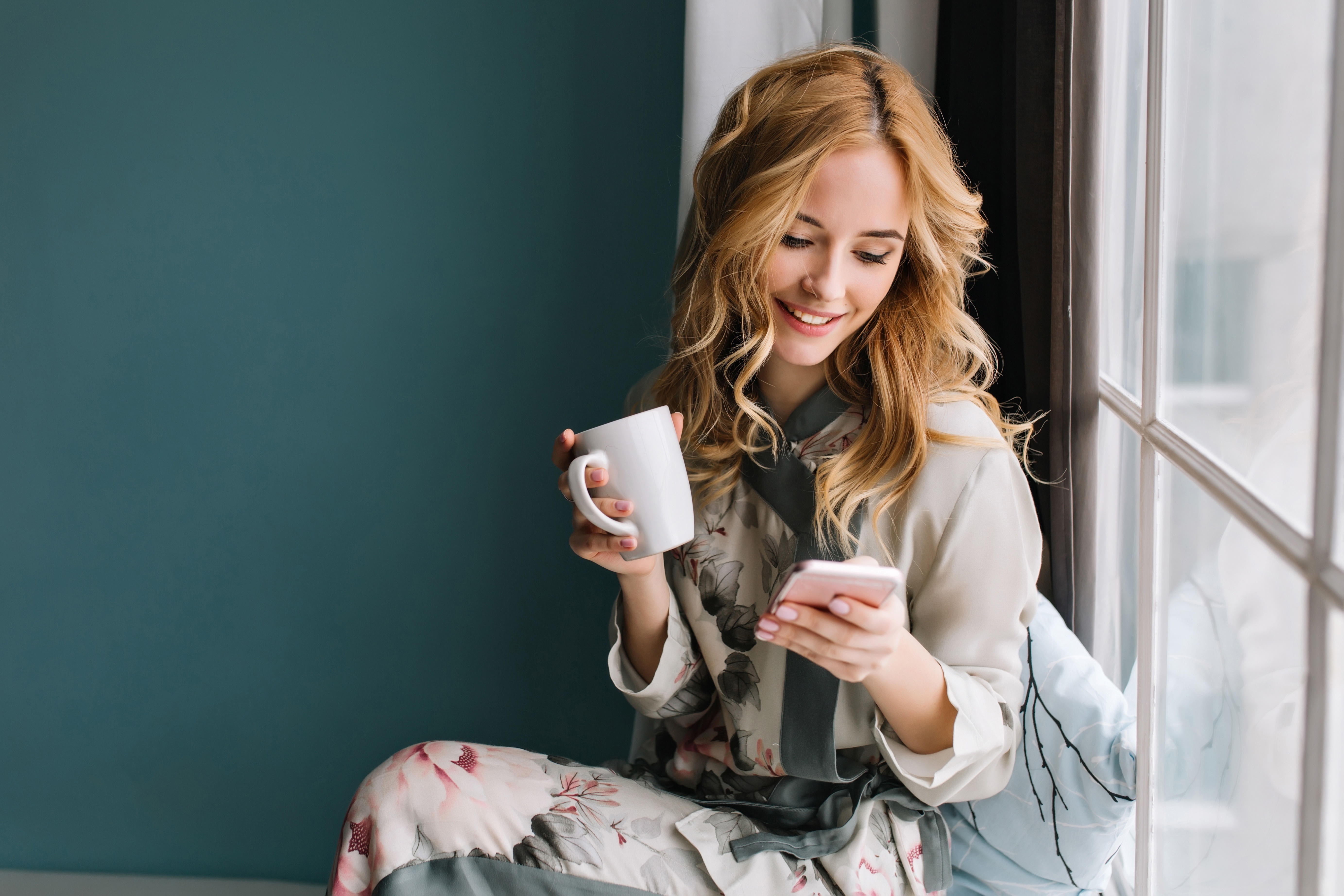 Woman with Mug and Smartphone by Window HD Wallpaper