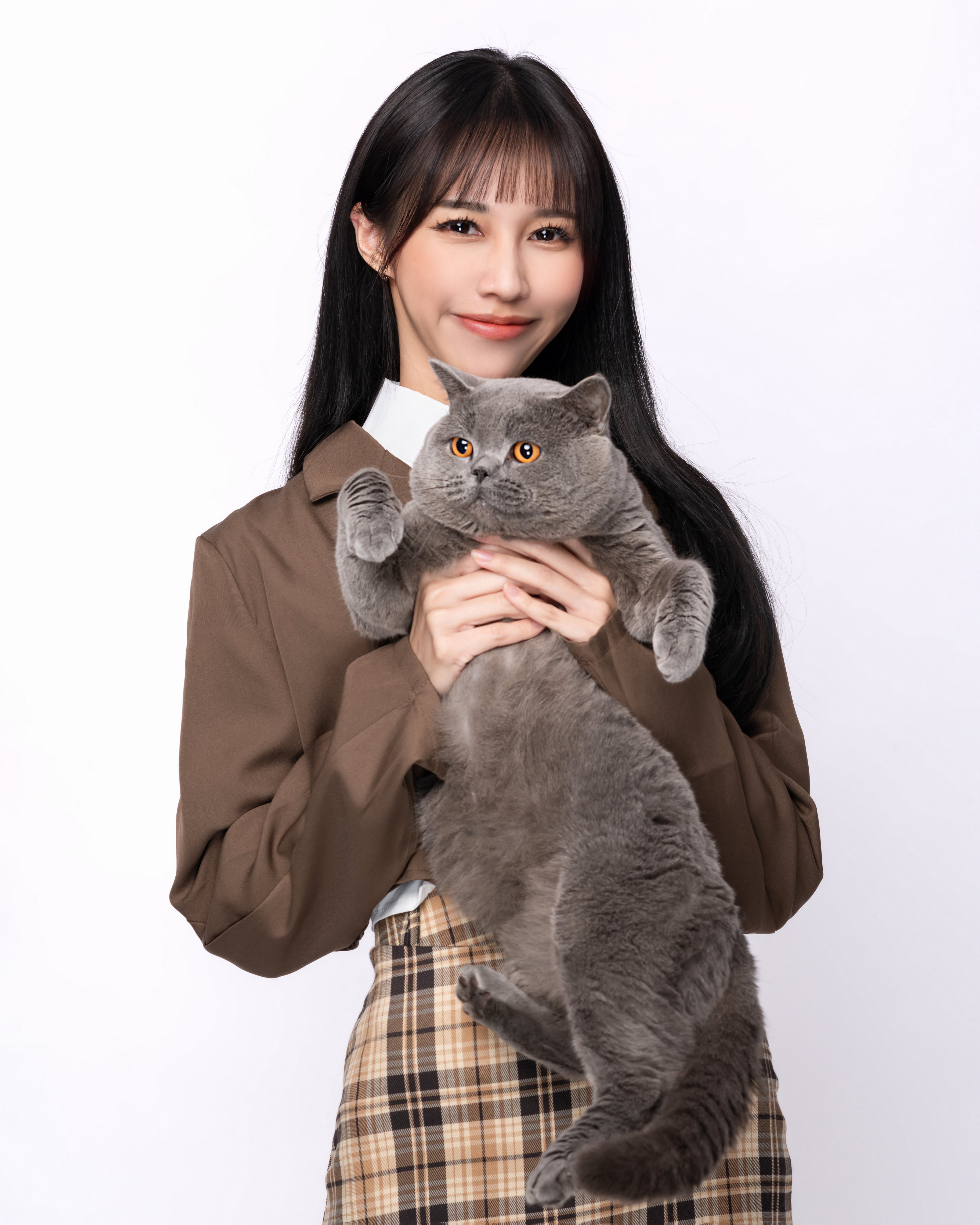 Asian woman holding a British Shorthair cat HD Phone Wallpaper