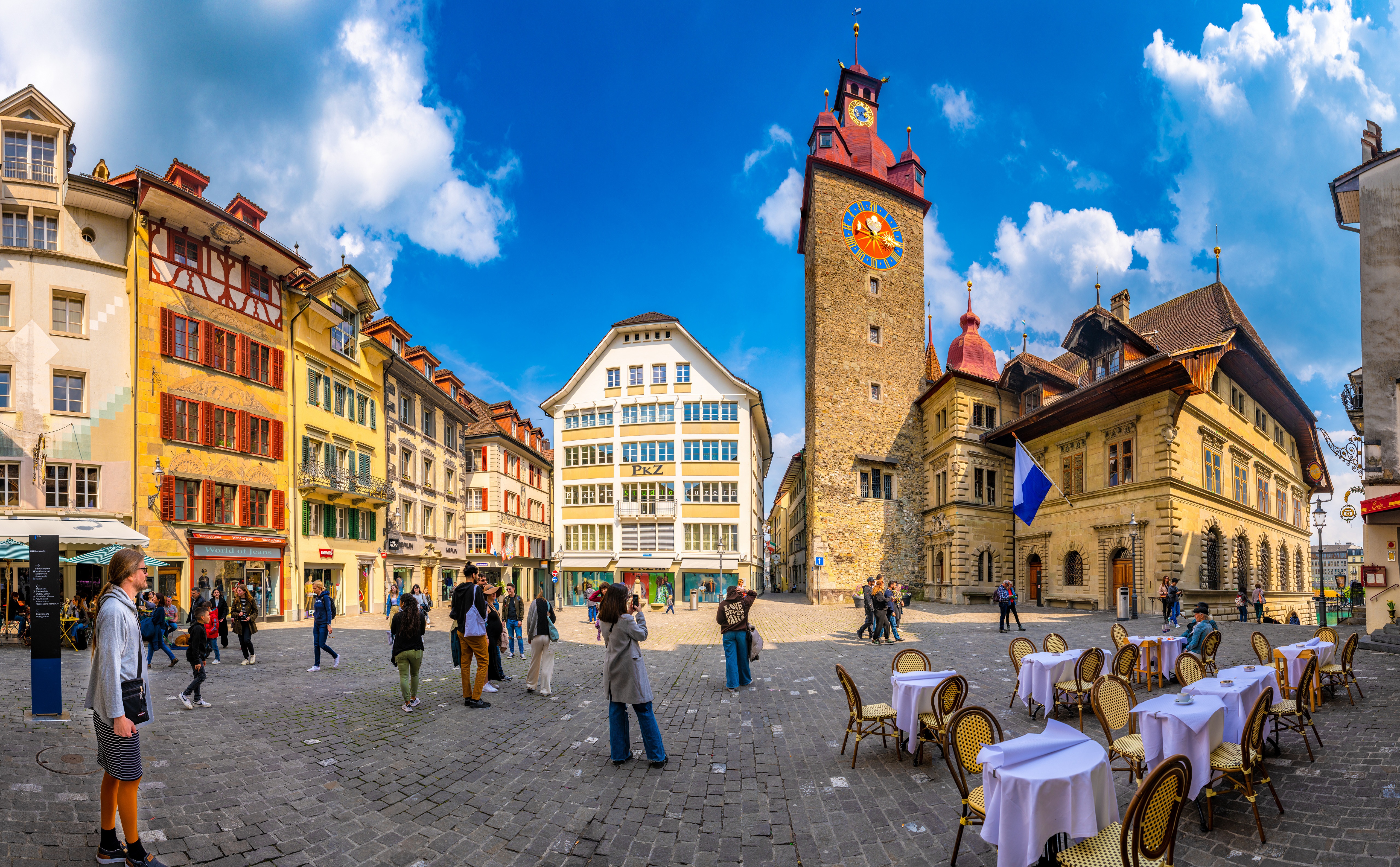 Town square with clock tower in Luzern, Switzerland HD Wallpaper