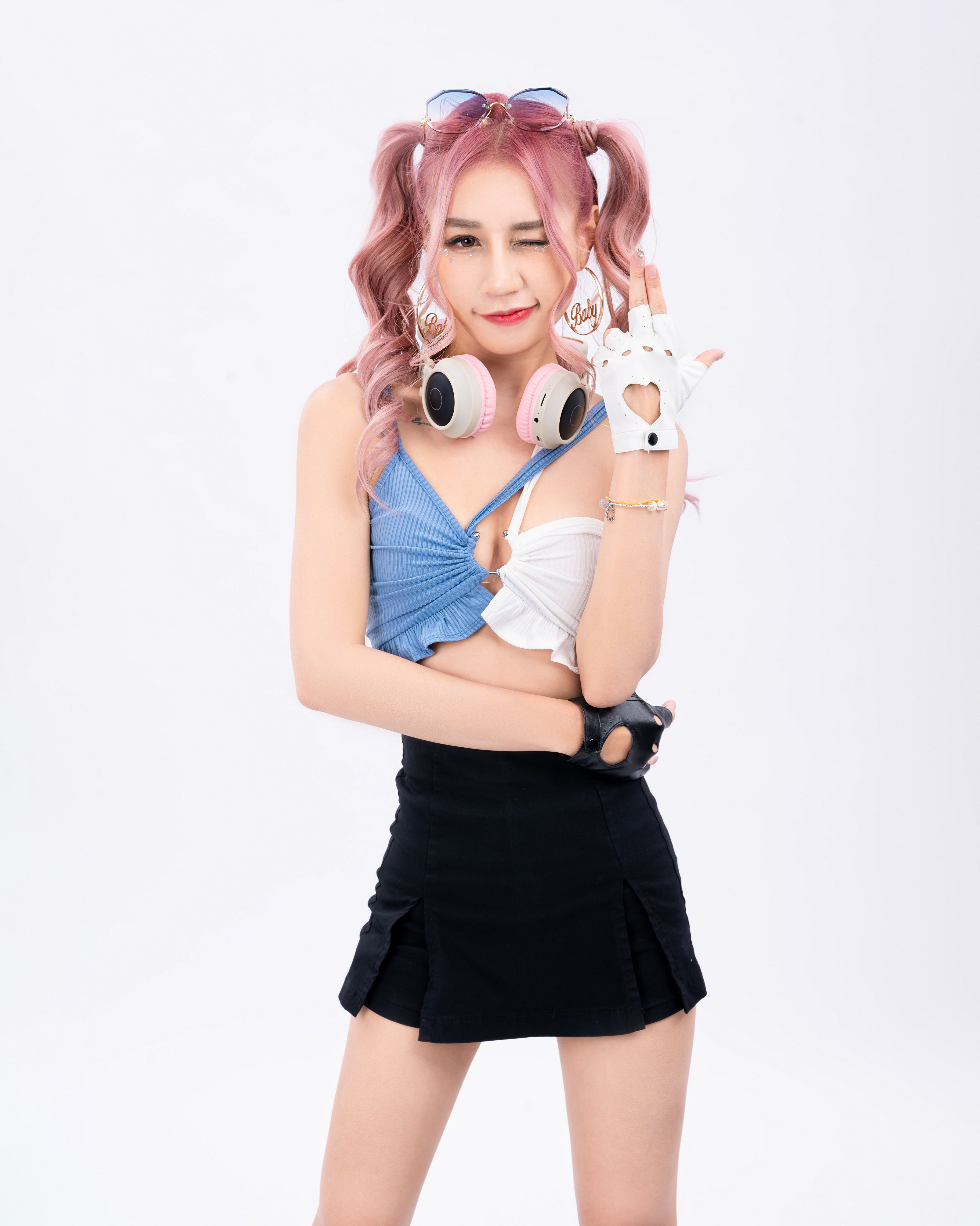 Woman with pink pigtails wearing headphones and gloves HD Phone Wallpaper