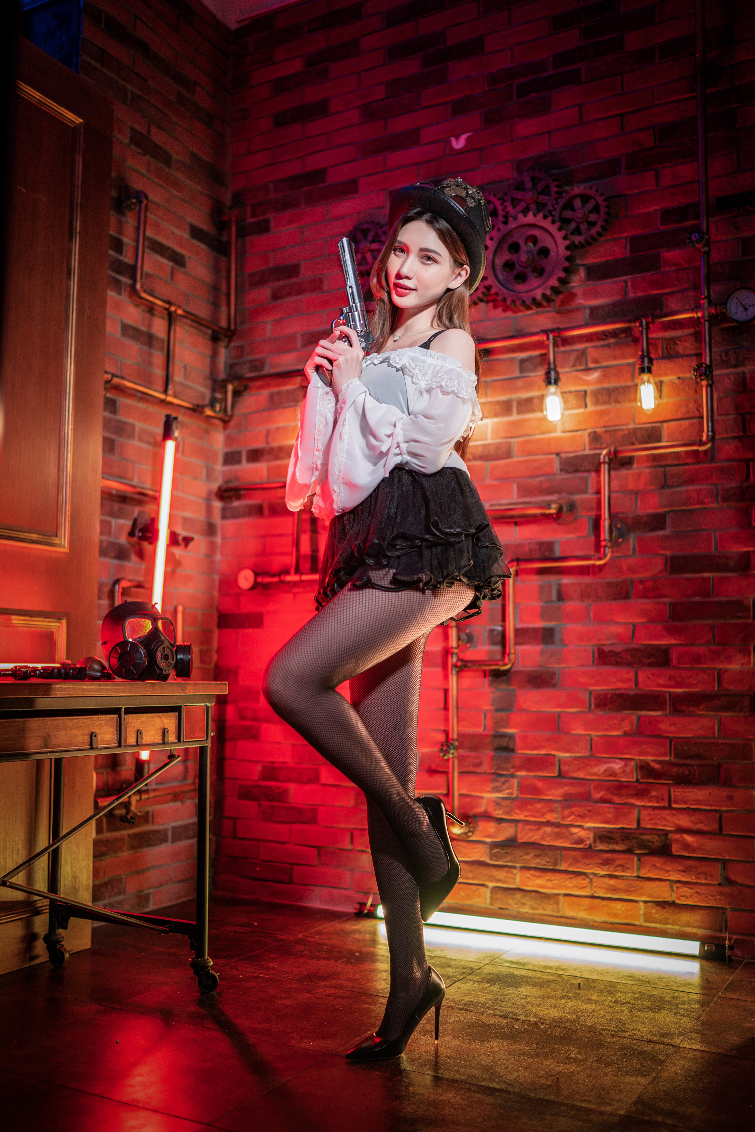 Asian woman in steampunk outfit holding a pistol HD Phone Wallpaper