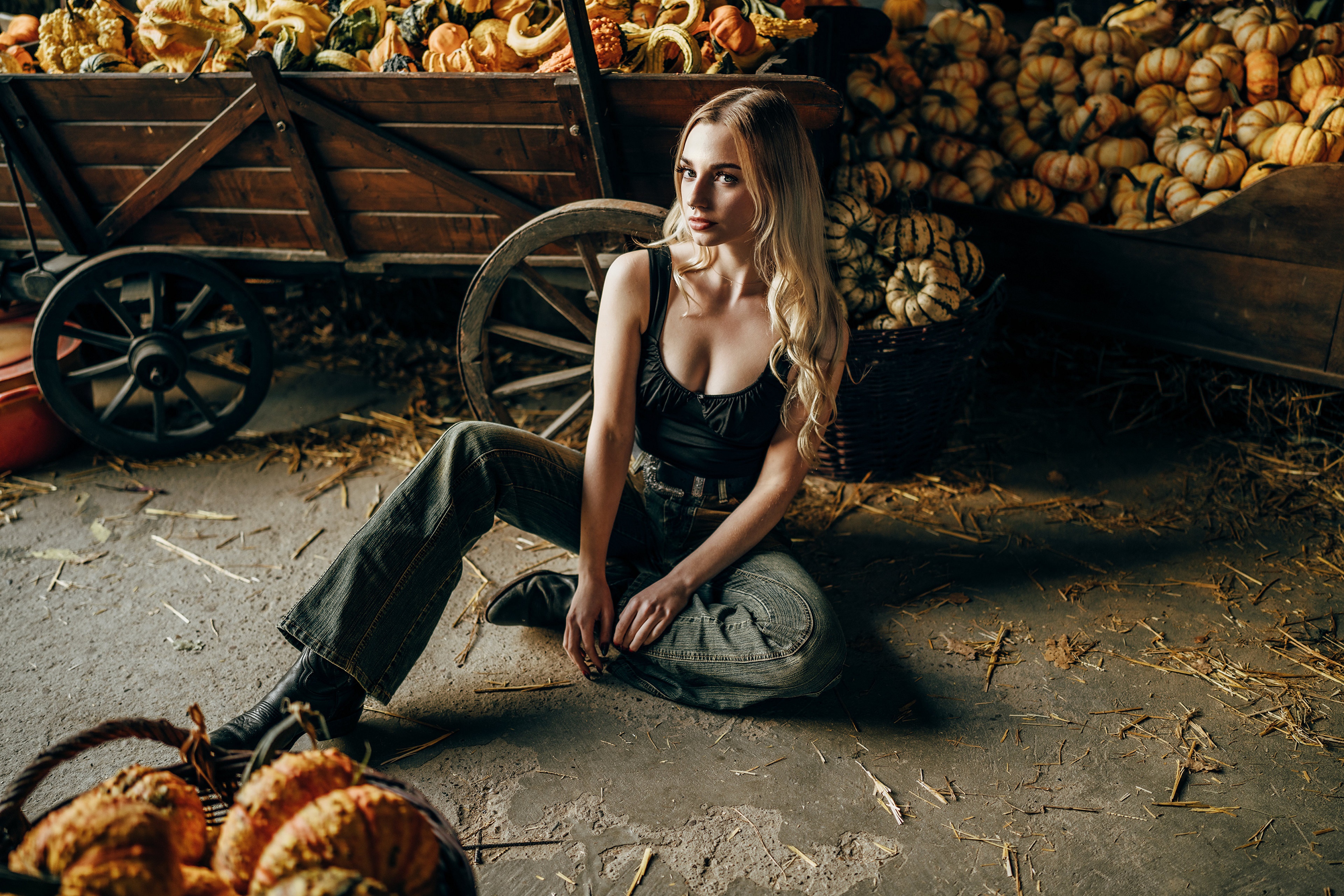 Blonde girl sitting with pumpkins HD Wallpaper